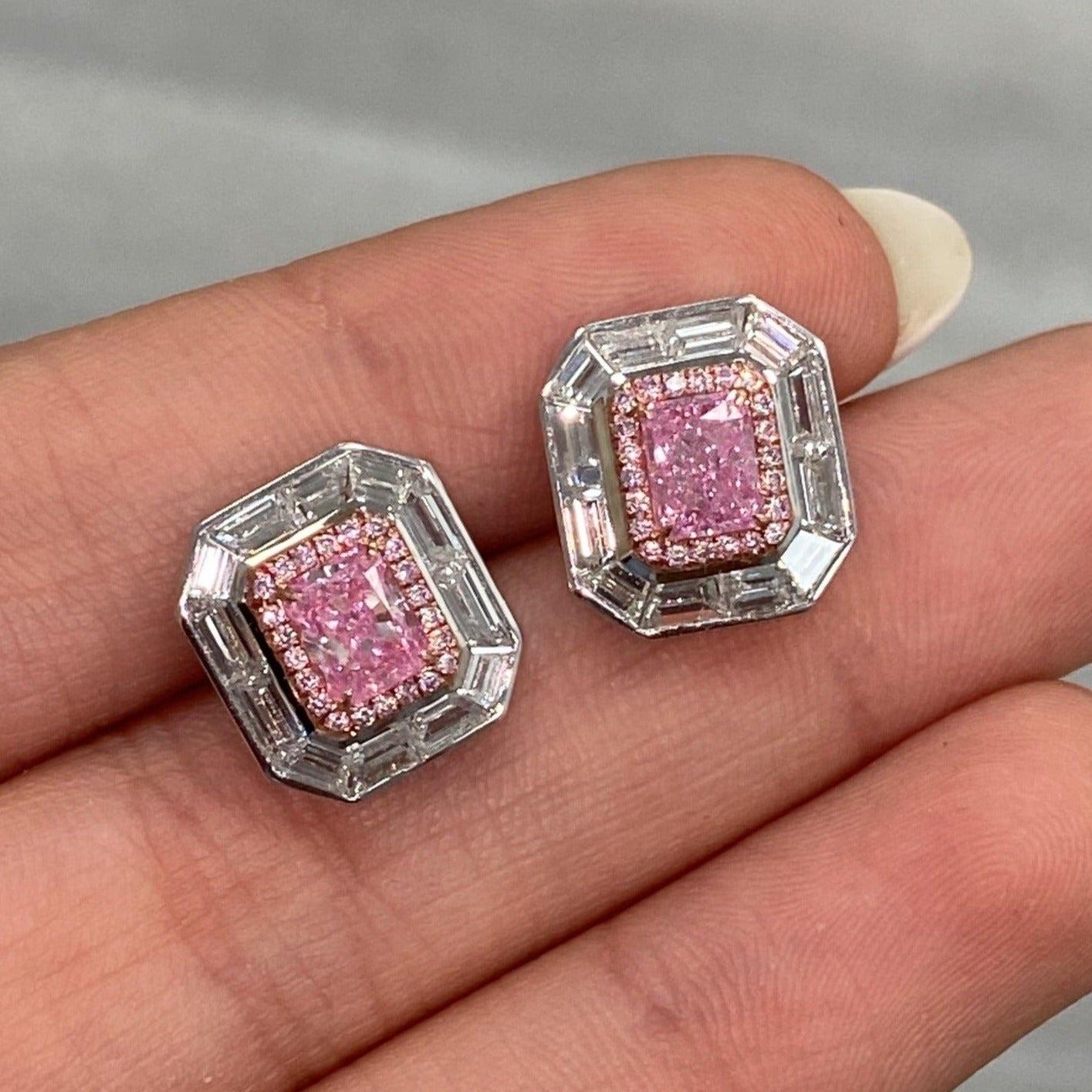 0.71 and 0.72 Carat Center Diamonds 
3.47 Carat Total Weight
GIA Faint Pink 
Elongated Radiant Cuts
Internally Flawless and Eye Clean SI1 Clarity 
Surrounded by 2.04 Carats of white and pink diamonds
Crafted in 18K white gold
GIA Certified Pink