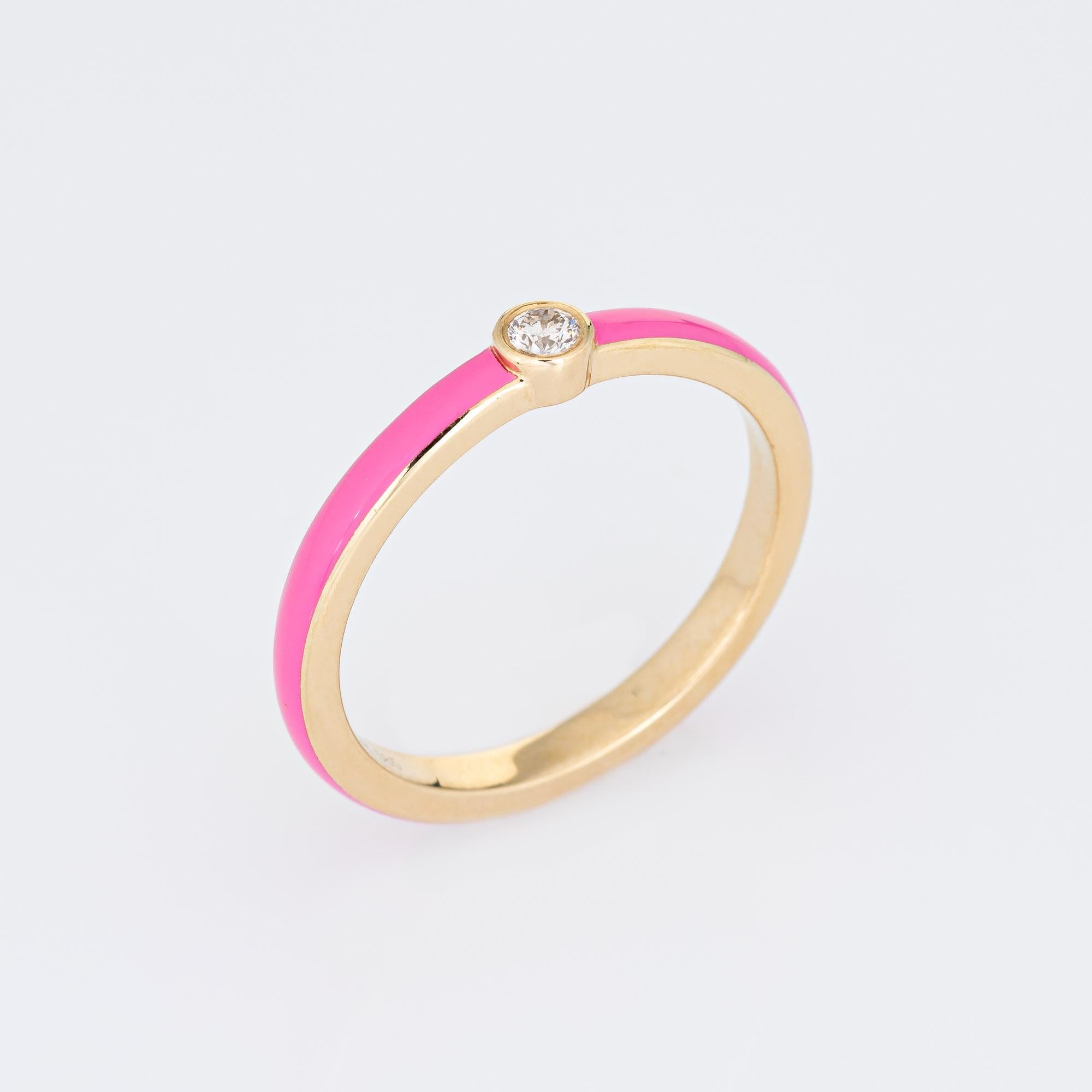 Stylish pink enamel & diamond stacking band crafted in 14 karat yellow gold. 

1 round brilliant cut diamond totals an estimated 0.03 carats (estimated at H-I color and SI2 clarity). 

The enameled band is a striking pink color with a small diamond