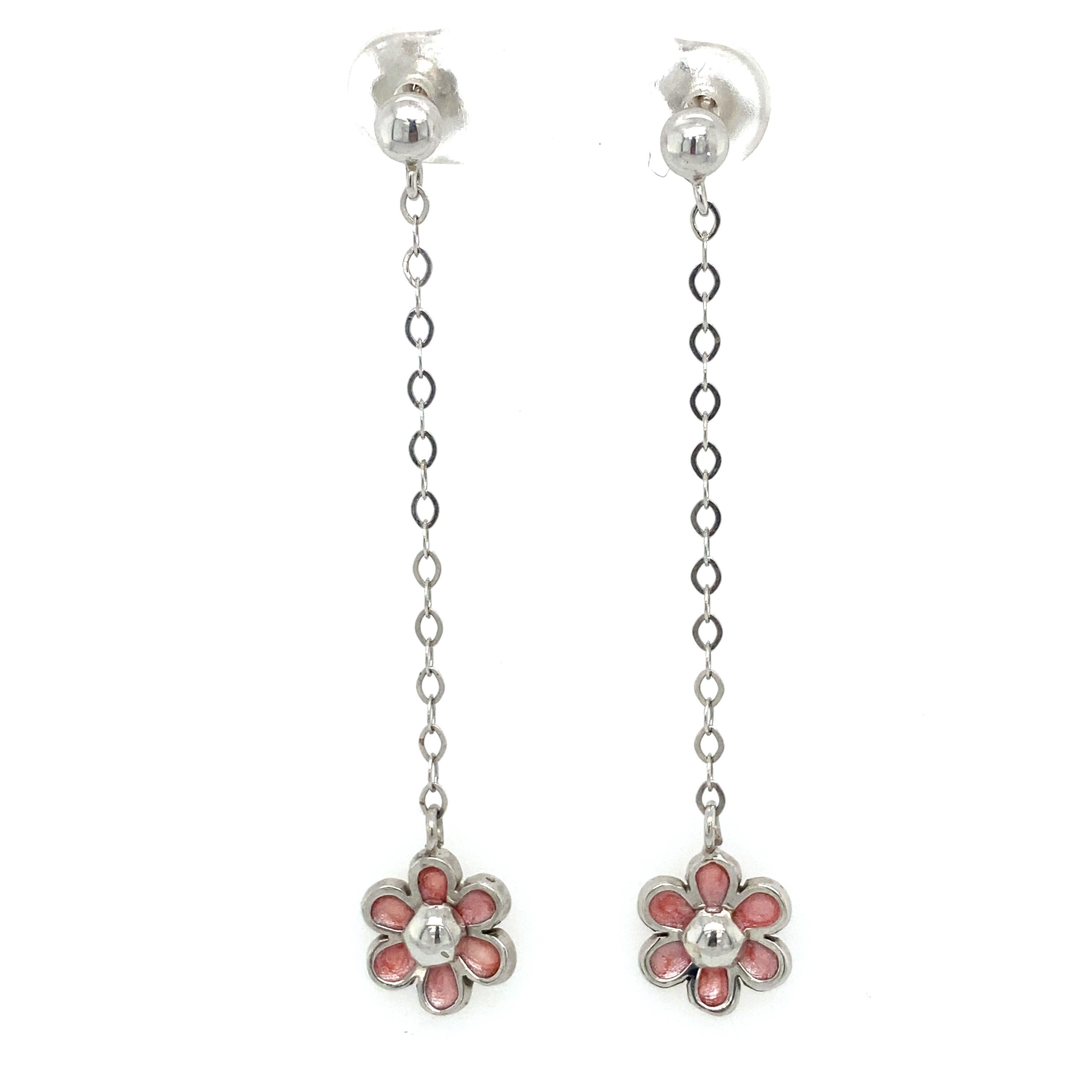 Item Details: These dainty drop earrings have flower drops with pink enamel petals. 

Circa: 1990s
Metal Type: 14 Karat White Gold
Weight: 2.7 grams
Size: 2 inch Length