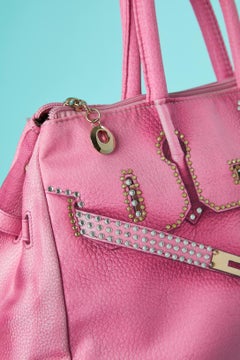 Pink fabric top handle bag with "trompe l'oeil" print and rhinestone Moschino