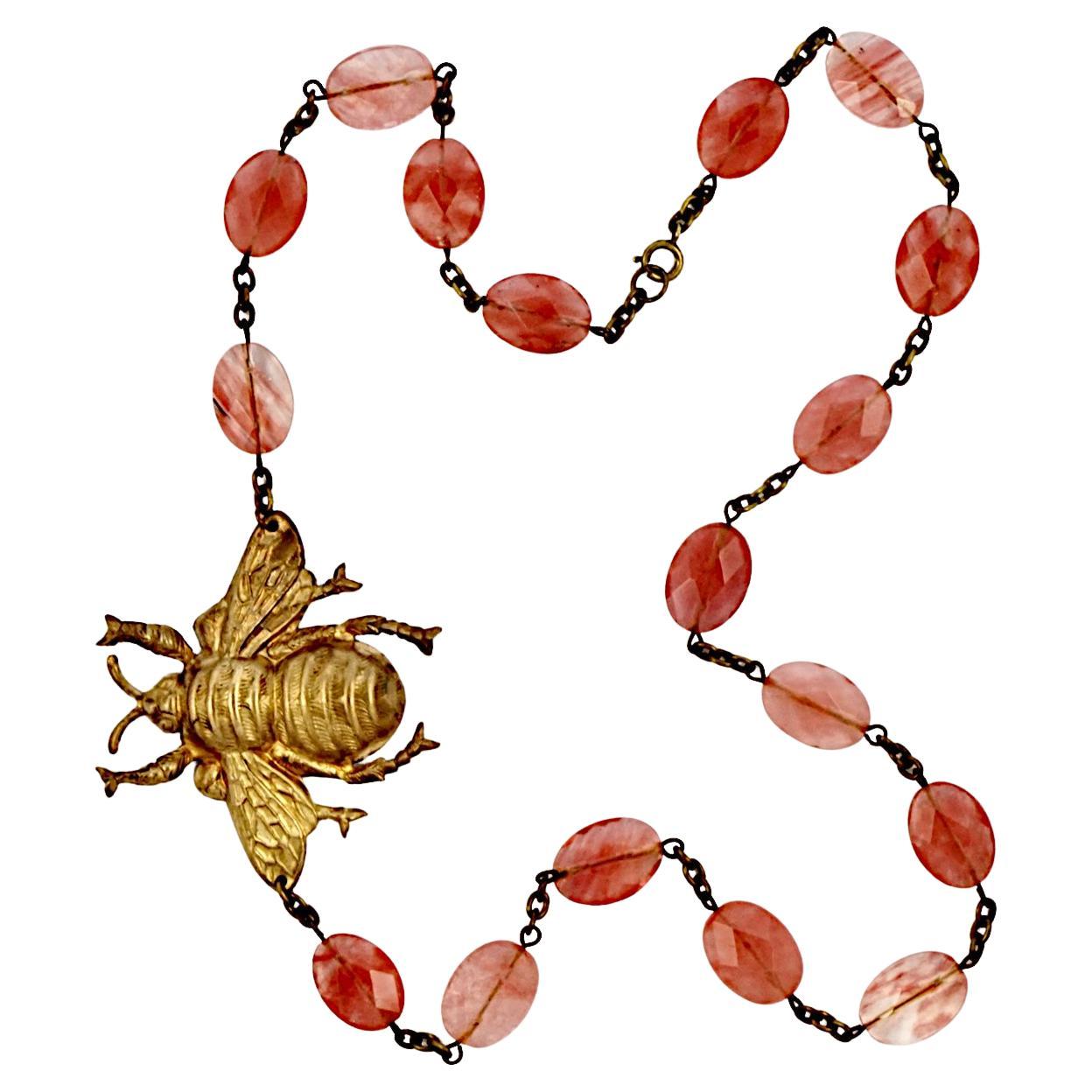 Pink Faceted Gemstone Necklace with a Gold Plated Large Brass Bee For Sale