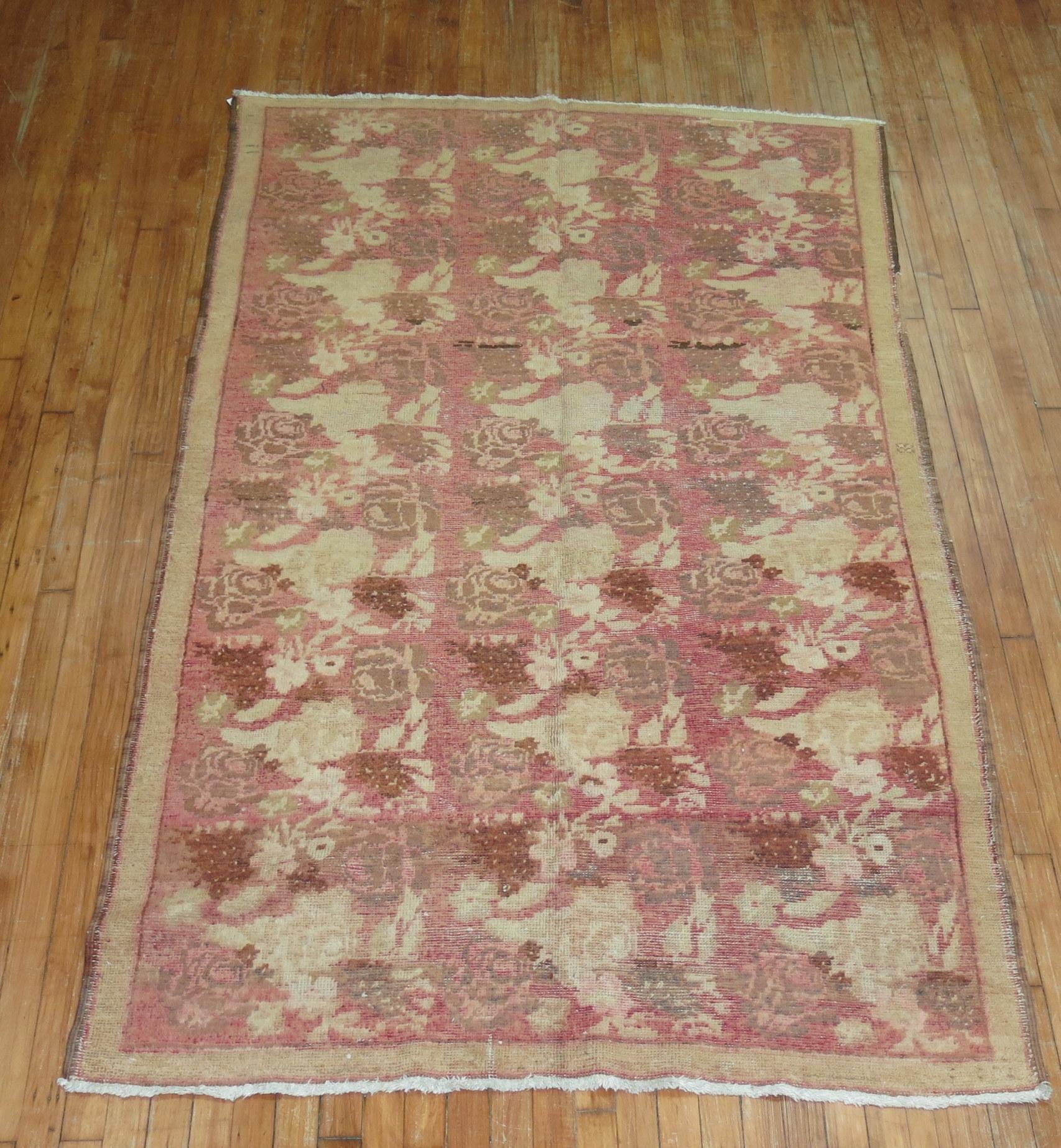 A mid 20th century Russian Karabagh Accent Size rug with brown and beige accents on a pink field

Measures: 4'6'' x 7'8''.