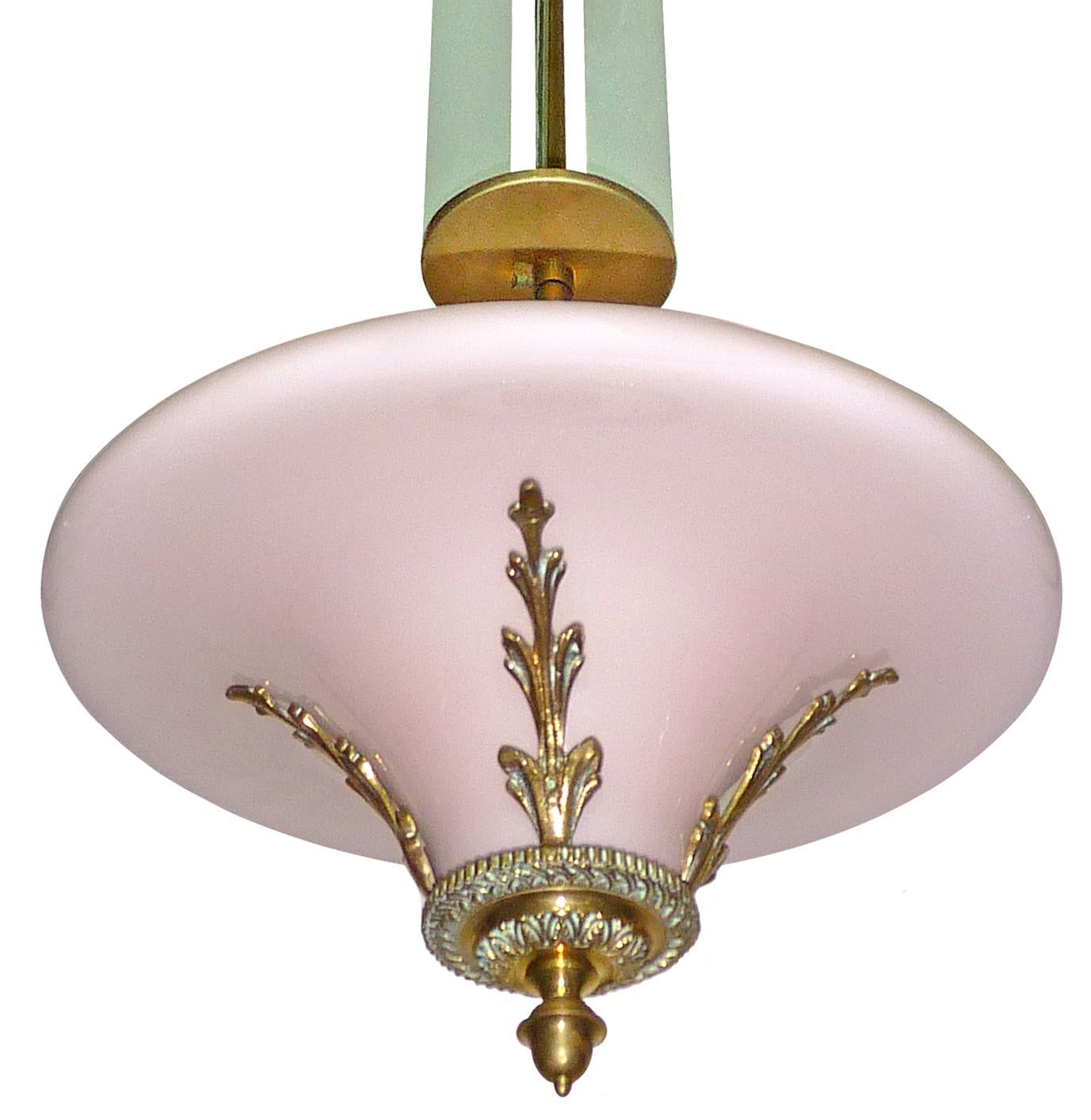Antique pink French Art Deco or Art Nouveau bronze and opaline glass hanging chandelier in the style of Petitot with four frosted glass strips each, circa 1920.
Beautiful age patina
Measures:
Diameter 15 in / 36 cm
Height 36 in / 90 cm
Weight 7 lb.