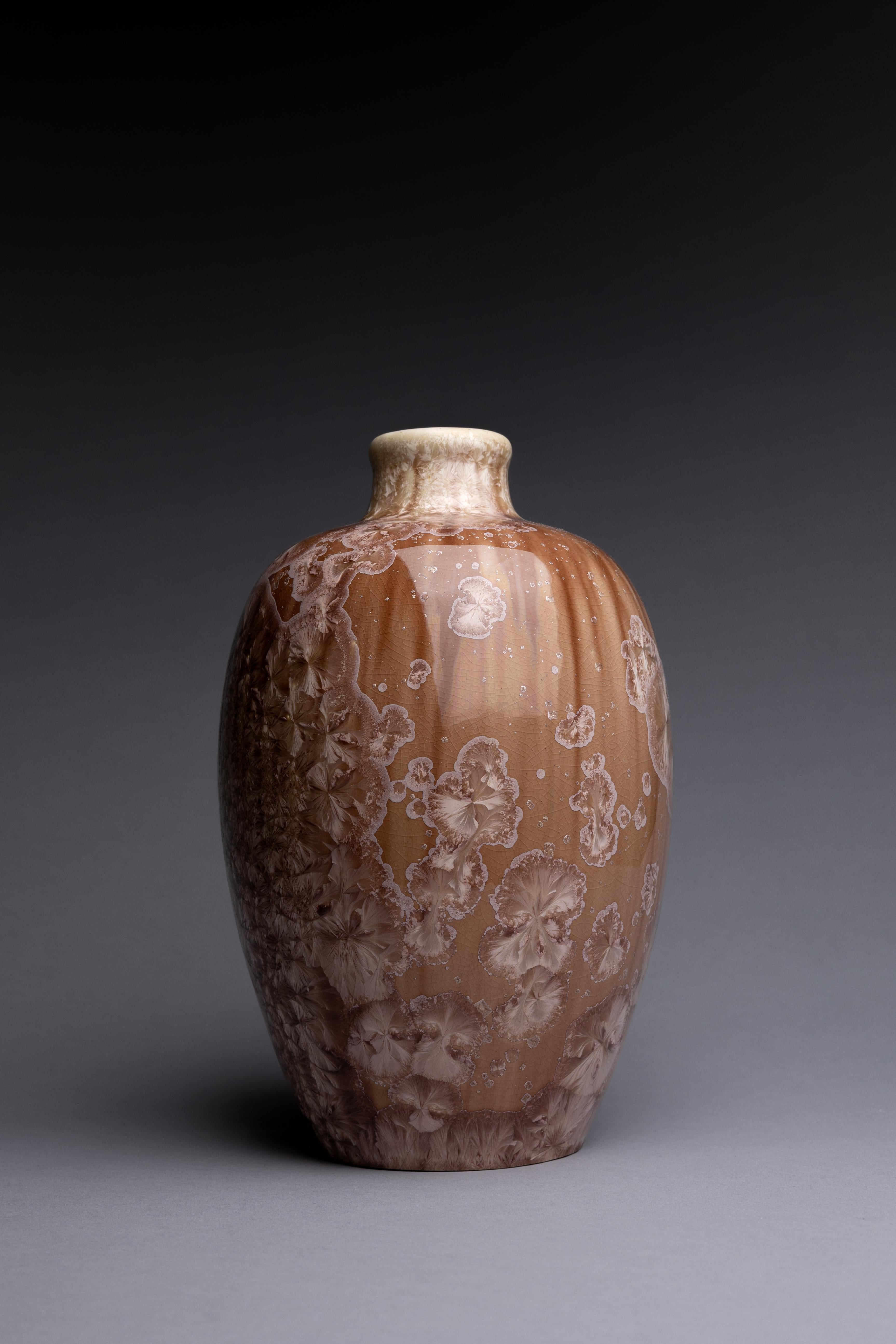 A crystalline-glazed porcelain vase, produced by the Mougin brothers circa 1910.

A sumptuous crystalline glaze covers this porcelain vase, made by the Frères Mougin around 1910. After studying ceramic techniques at Sèvres, Joseph Mougin joined
