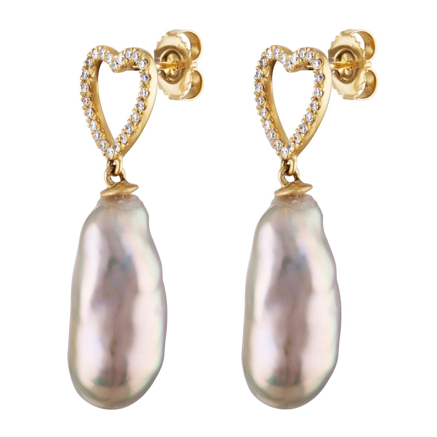 These earrings feature Freshwater metallic pink color baroque pearls featuring heart shaped 14K yellow gold and diamonds. The pearls measure 13.6x22.6mm and there are 0.36 carats total of diamonds. The earrings are secured by butterfly friction