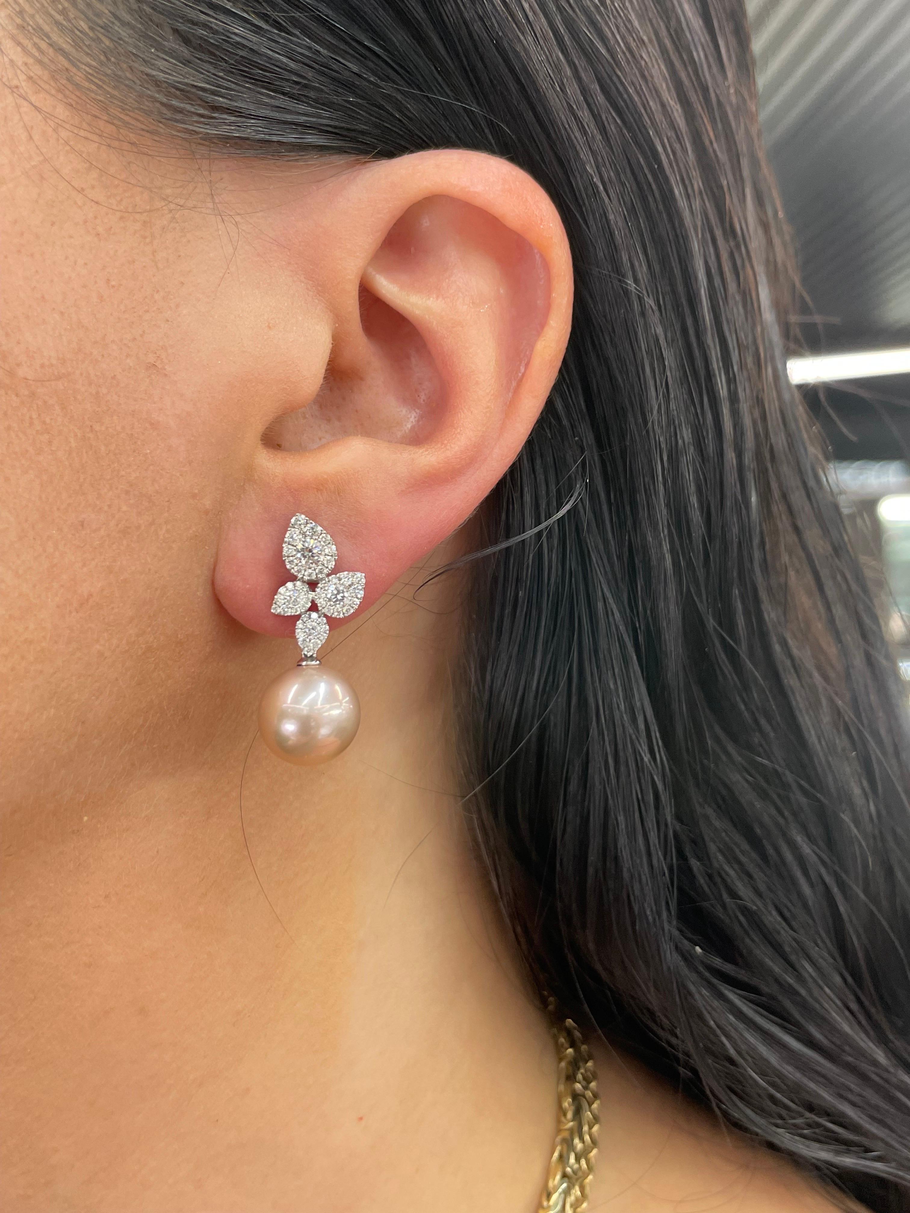18 Karat White Gold floral drop earrings featuring 92 round brilliants weighing 1.05 Carats and two Pink Freshwater Pearls measuring 11-12 MM.
Color G-H
Clarity SI

Can be ordered in Gold South Sea, White South Sea or Tahitian Pearls 
DM for pricing 