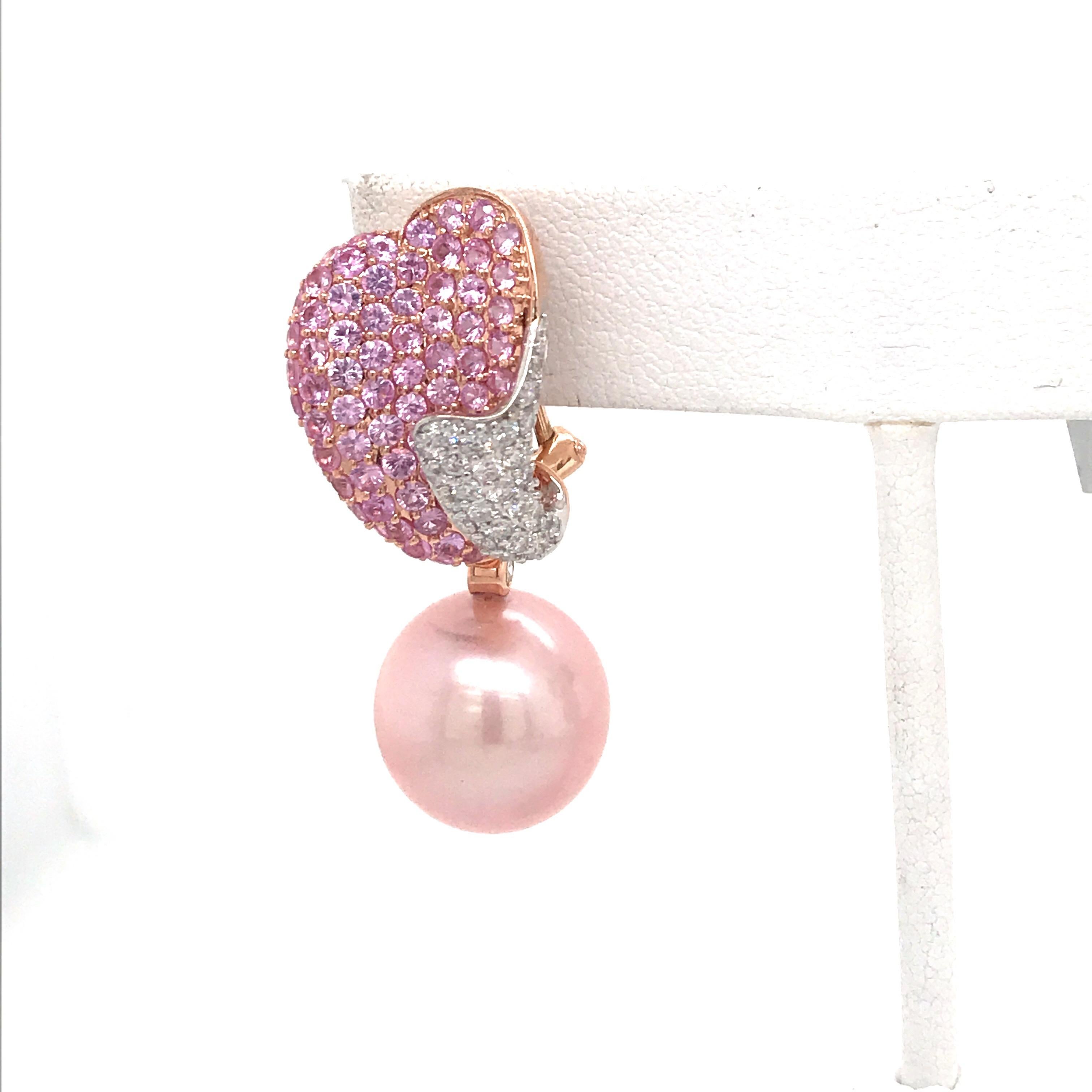 18K Rose gold drop earrings featuring two Pink Freshwater Pearls measuring 14-15 mm, 140 pink sapphires weighing 4.20 carats and round brilliants 1.05 carats. 