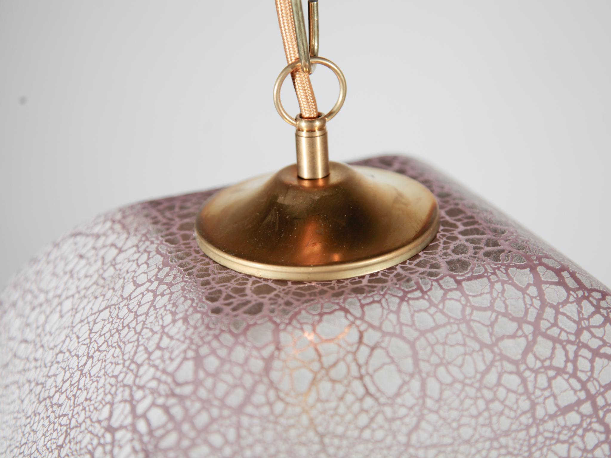 A beautiful piece of Murano Art glass pendant, hanging lamp with brass elements designed and signed by Alfredo Barbini, made in Italy. The design of the blown pink glass with the processed gray tones of the iron oxide craquelure in the glass gives