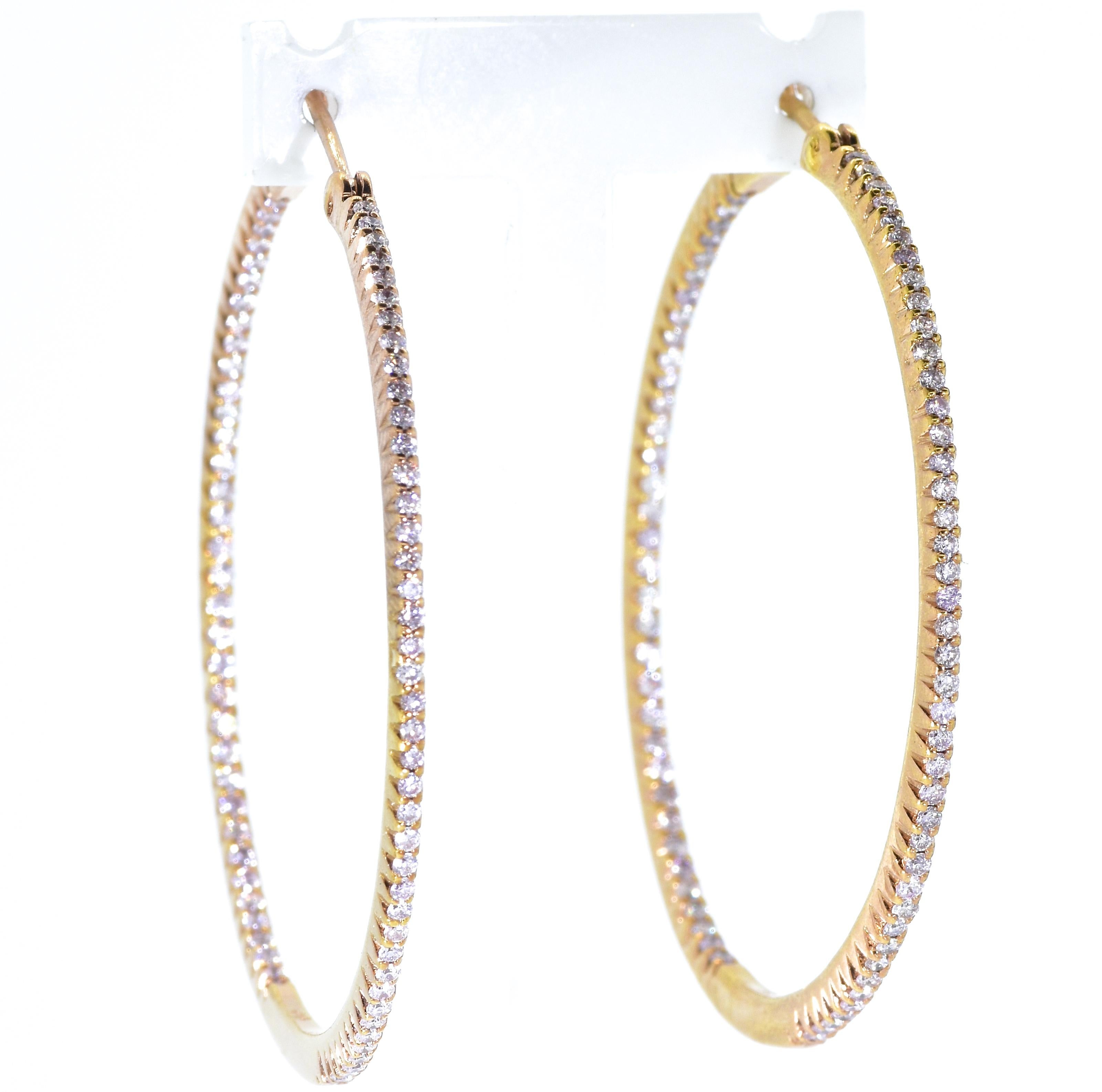 Hoop Earrings with diamonds set throughout.  There are 150 fine white diamonds, .98 cts., (a light carat), well cut and well matched, G/H (near colorless), and very slightly included (VS),  These new hoop earrings have an interior dimension of 1.5/8