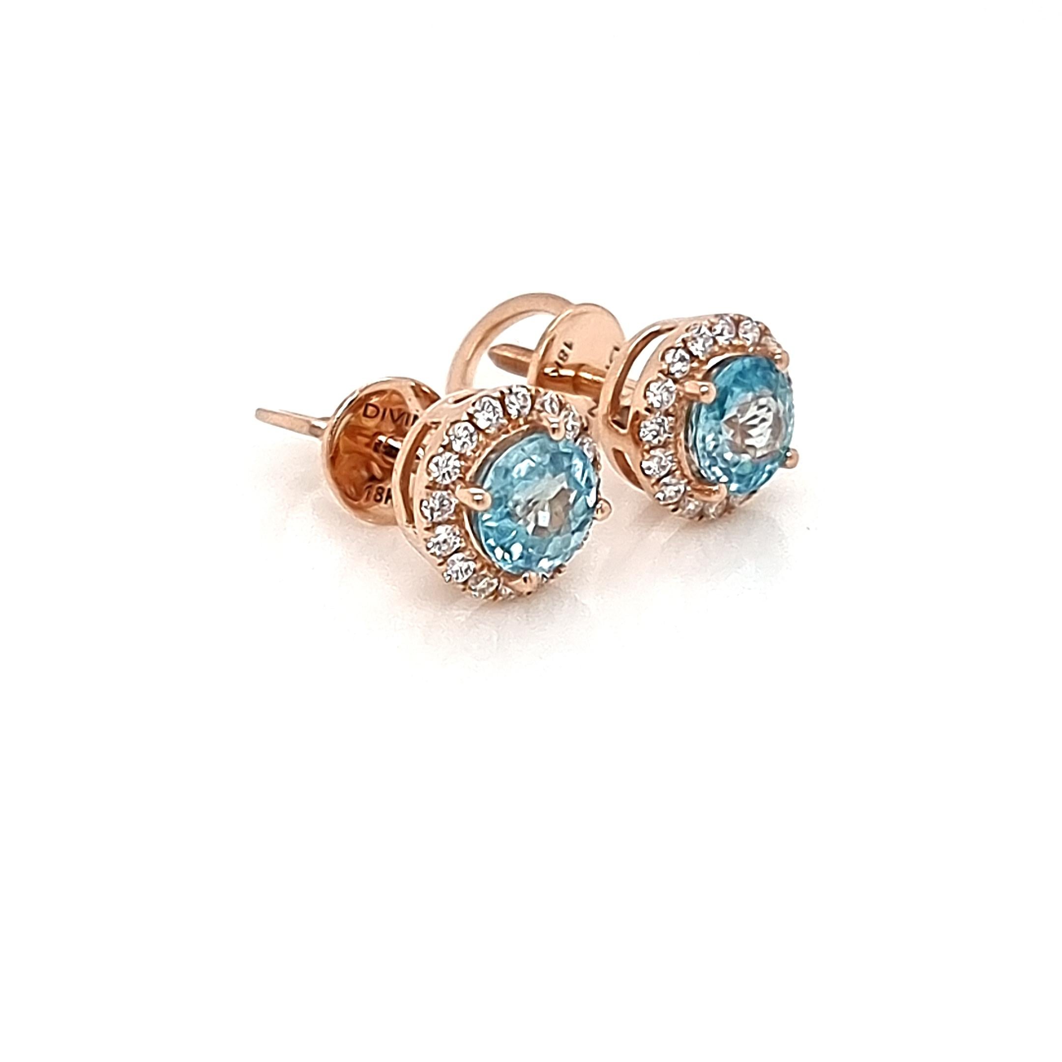 Introducing our exquisite earrings crafted with a captivating blend of 18K pink gold, gleaming white diamonds encircling the halo, and a mesmerizing blue natural 70 points zircon. These earrings boast a stunning and luxurious design, perfect for