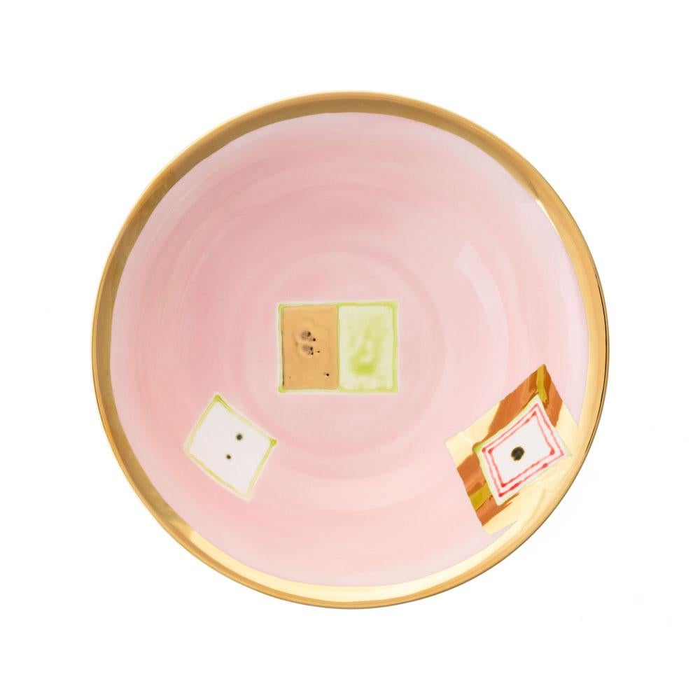 The Gold Impressions collection takes Coralla's exploration of geometry and minimalism to a new dimension, infusing her iconic designs with radiant gold accents. These golden elements transform familiar symbols, like the Mountain, into luminous