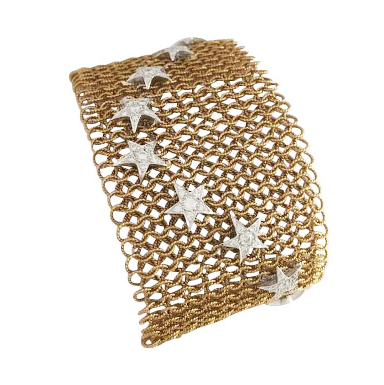 750/000 Pink gold Mesh coat bracelet, decorated with 16 stars set with brilliants.
Extremely confortable and soft to wear. End clasp with two push buttons.
Total weight of diamonds : about 1.60 carat
Weight : 59.3 grams
Length : 170 mm
Width : 40