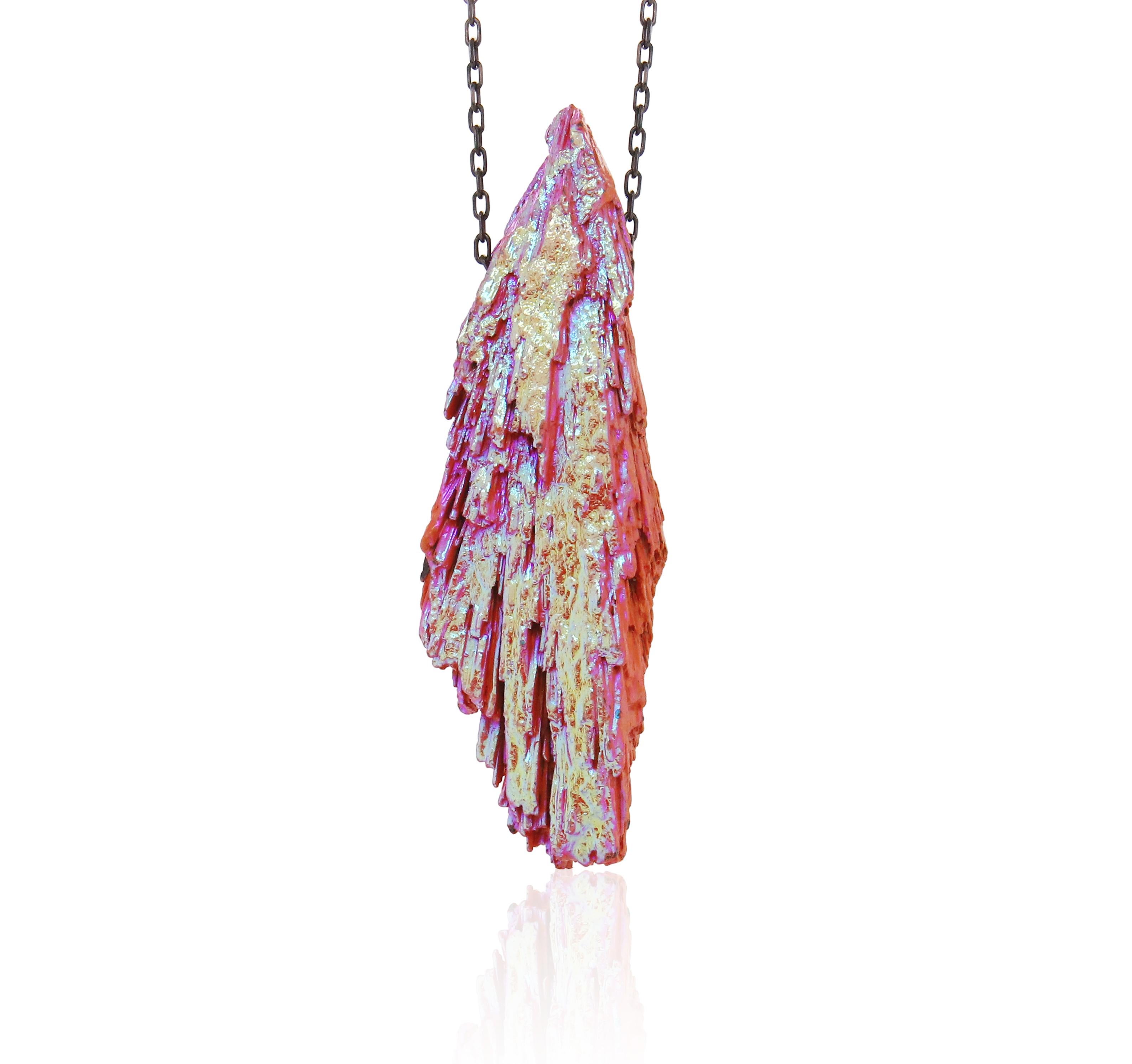 A unique, large pink and gold Kyanite on a black silver chain!

Fine one-of-a-kind craftsmanship meets incredible quality in this breathtaking piece of jewelry.

Undeniably rare, colorfully bright, and promised to last a lifetime, gemstones are