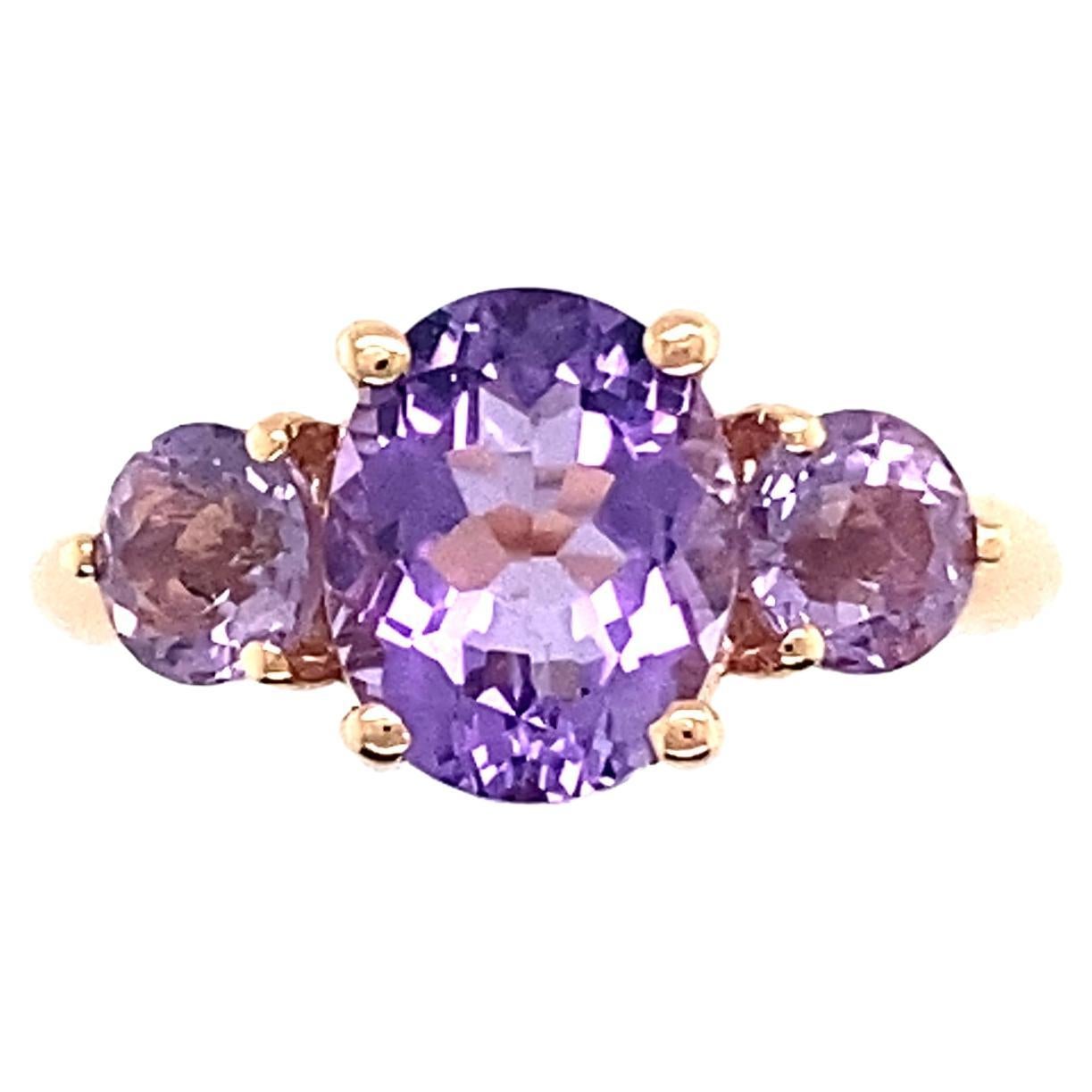 Pink Gold Ring Surmounted by 3 Amethyst.
This very feminine ring organized of 3 amethysts of different sizes on a frame in 18-carat pink gold stones are held part of the claws with round finishes for safety. 
The center amethyst measures 1cm by 7.5