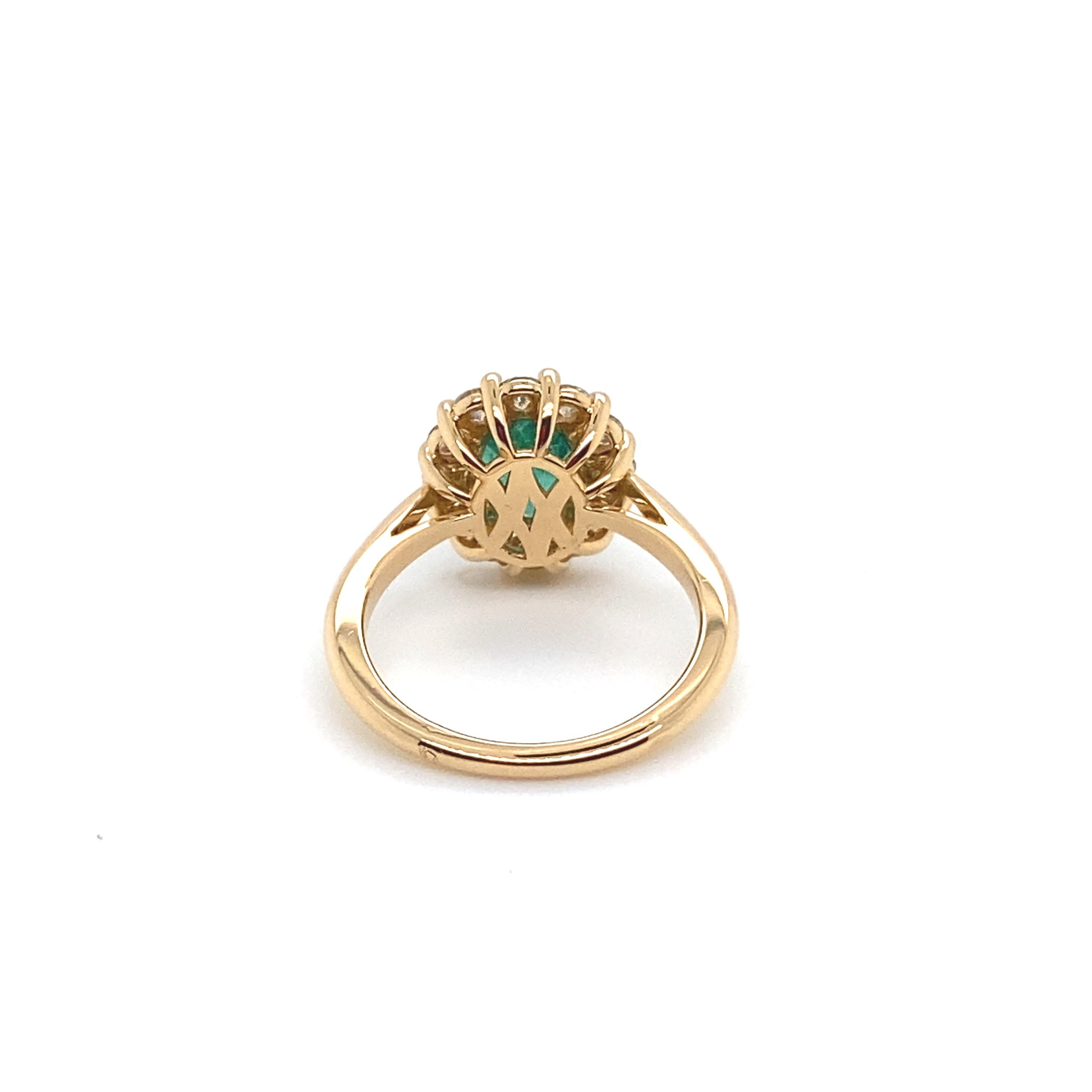Oval Cut Pink Gold Ring Surmounted by an Emerald Surrounded by Diamonds For Sale