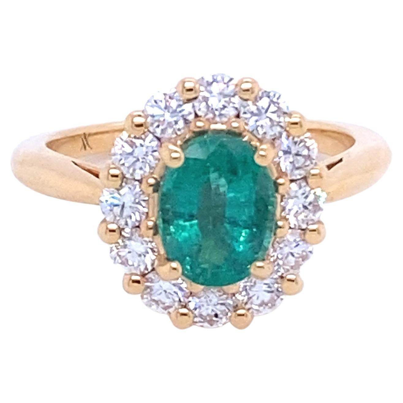 Pink Gold Ring Surmounted by an Emerald Surrounded by Diamonds For Sale