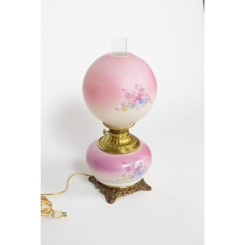 Pink gone with the wind lamp. Blue and pink flowers.

Material: Brass, Glass
Style: Victorian,Cottage
Place of Origin: United States
Period made: Late 19th Century
Dimensions: 9 × 9 × 21 in
Condition Details: Excellent Condition, Completely restored