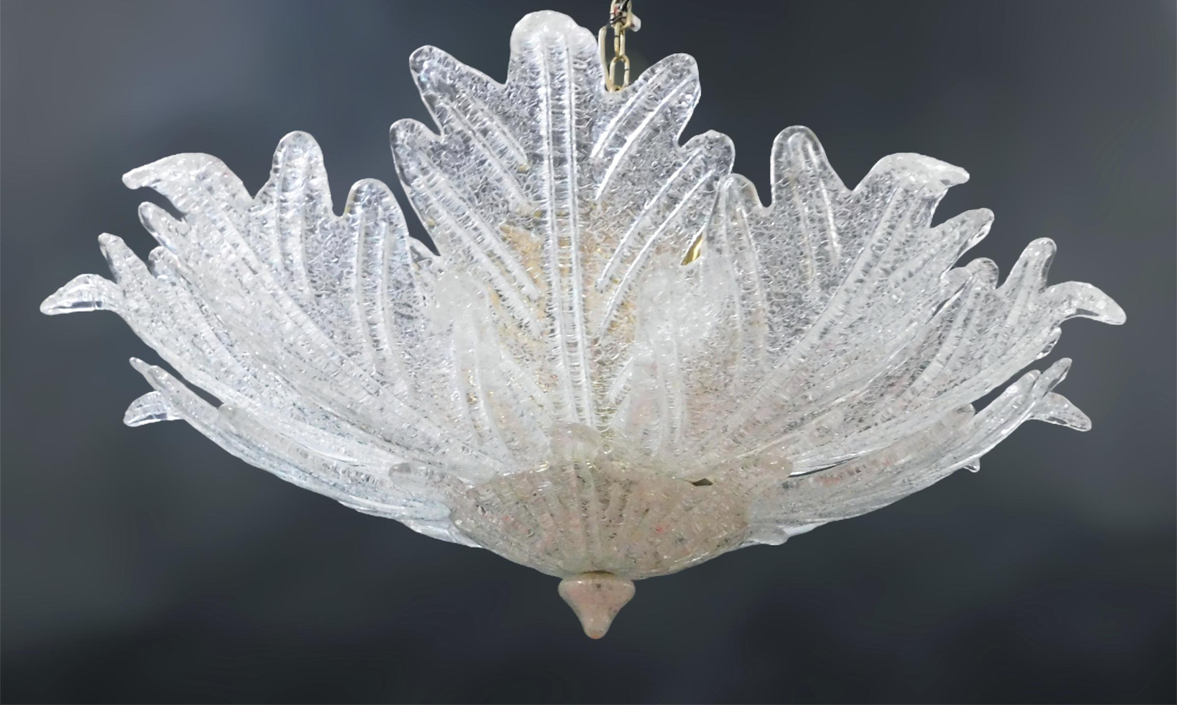 Vintage Italian Murano glass flush mount with clear and pink graniglia glass leaves mounted on gold finish metal frame / Made in Italy in the style of Barovier e Toso, circa 1960s
Measures: Diameter 35 inches, height 12 inches
10 lights / E12 or E14
