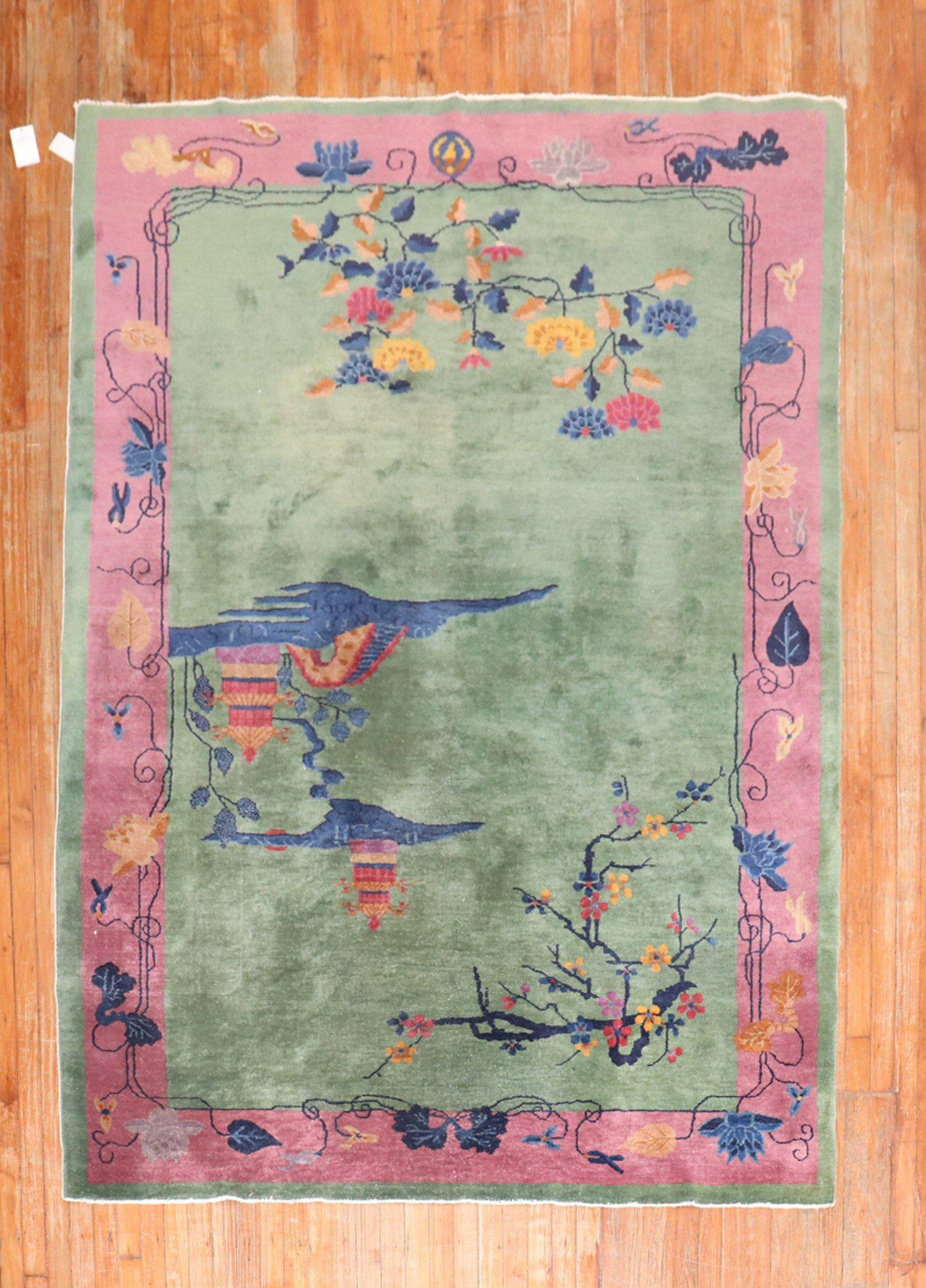 Enchanting early 20th century Chinese Art Deco carpet with a spacious floral design in dominant accents in green and pink.

Measures: 6' x 8'6''.