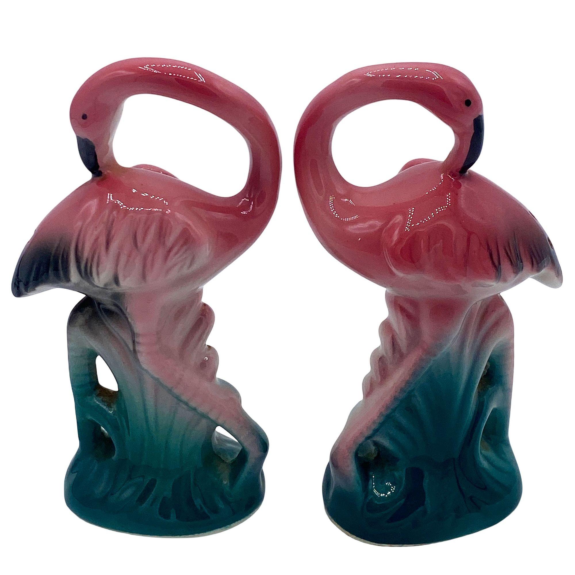 Mid-century pink and green ceramic flamingo tabletop salt & pepper shaker set by Five & Dime. The set features two beautifully detailed pink flamingos in lush green leaves and grass with a pink color.

Measurements: 4