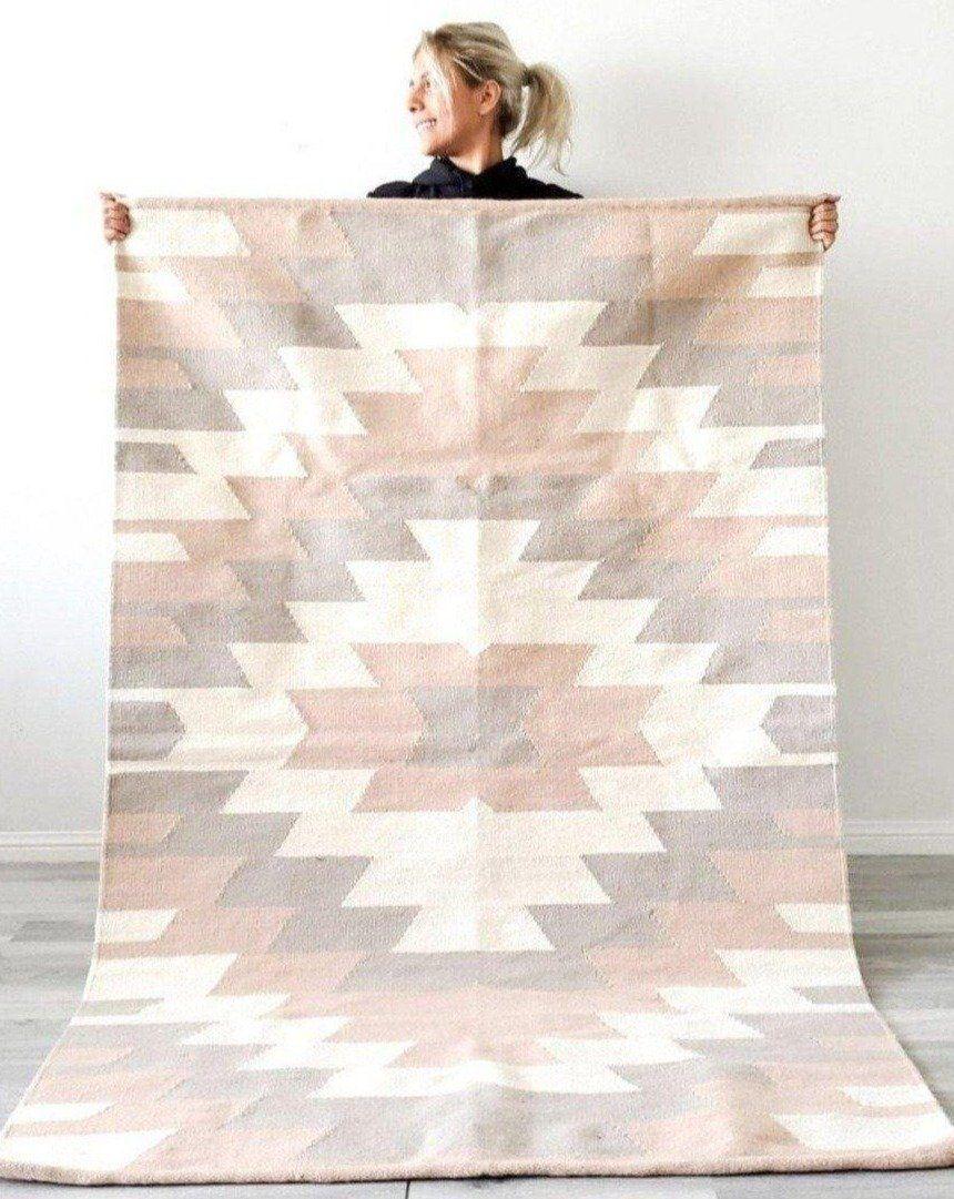 Product Information:
Made of natural wool
Colours: Muted Pink, Taupe, Cream
Designed in Canada 
Handmade in Egypt 
A pad is recommended to prevent slipping