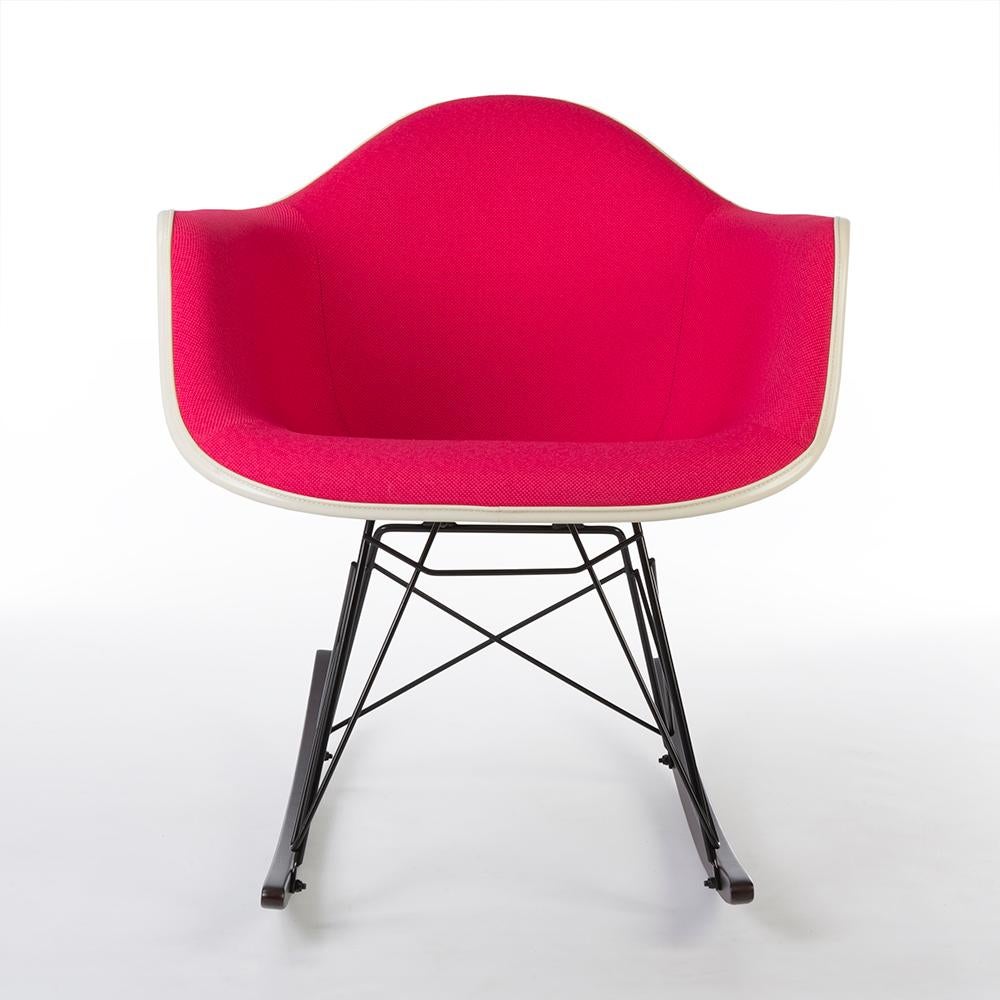 This is an original, hot pink Herman Miller Eames upholstered arm shell, with white porcelain fiberglass shell attached to a brand new walnut RAR dowel base. Since the new base is made from beautiful warm brown walnut wood, it varies slightly from