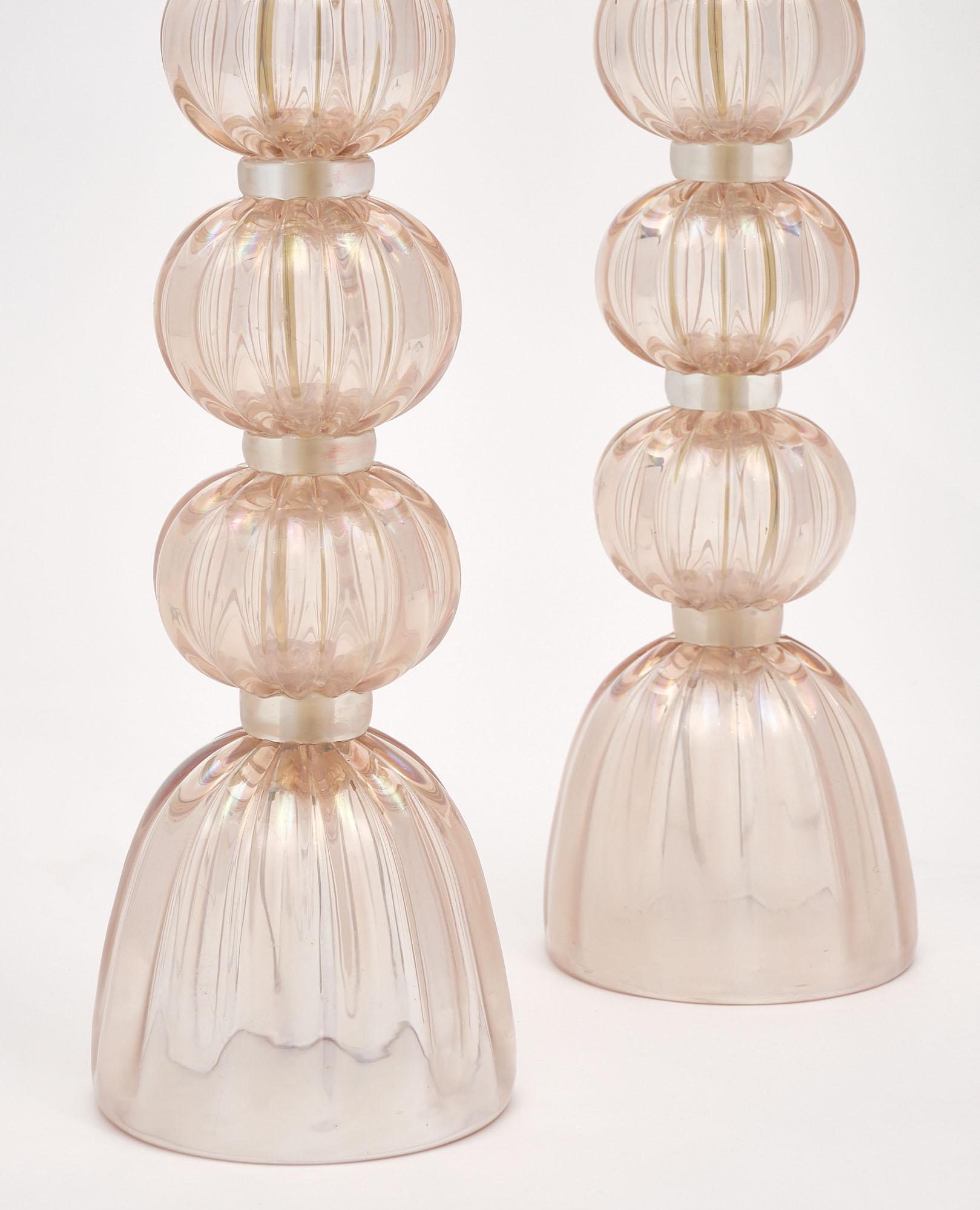 Pair of lamps from Murano; Italy made of hand-blown iridescent pink glass. They have been newly wired to fit US standards.

This pair is a special order from Italy. Please contact us for a lead time. 