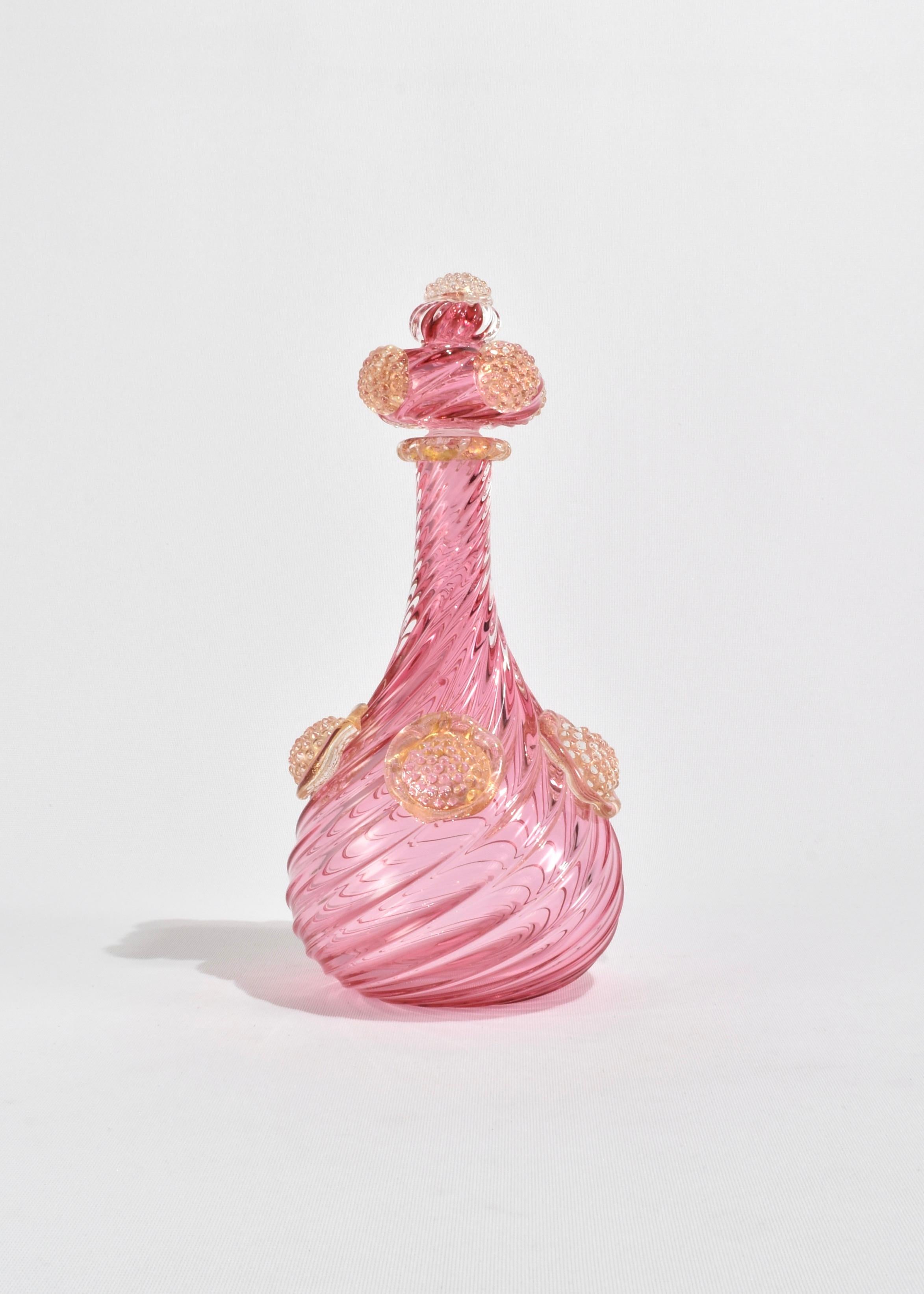 Stunning, hand-blown pink glass decanter in an optical design with gold fleck prunt detail. Made in Murano, Italy.