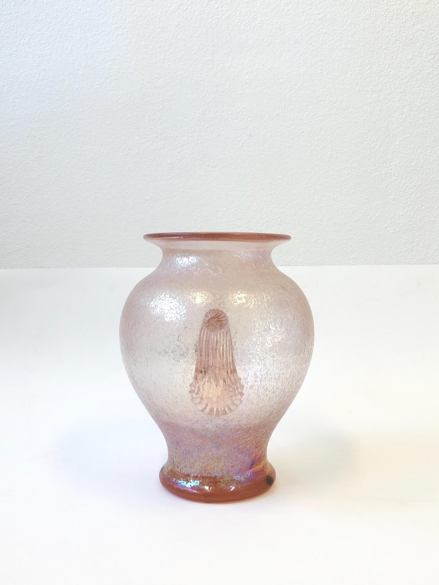Large 1980s pink Italian scavo Murano glass vase by Seguso. Hand blown with a rough texture finish.
The vase retains the Seguso Vetri d’Arte label.
Measurements: 14” high, 14” wide and 11” deep.
