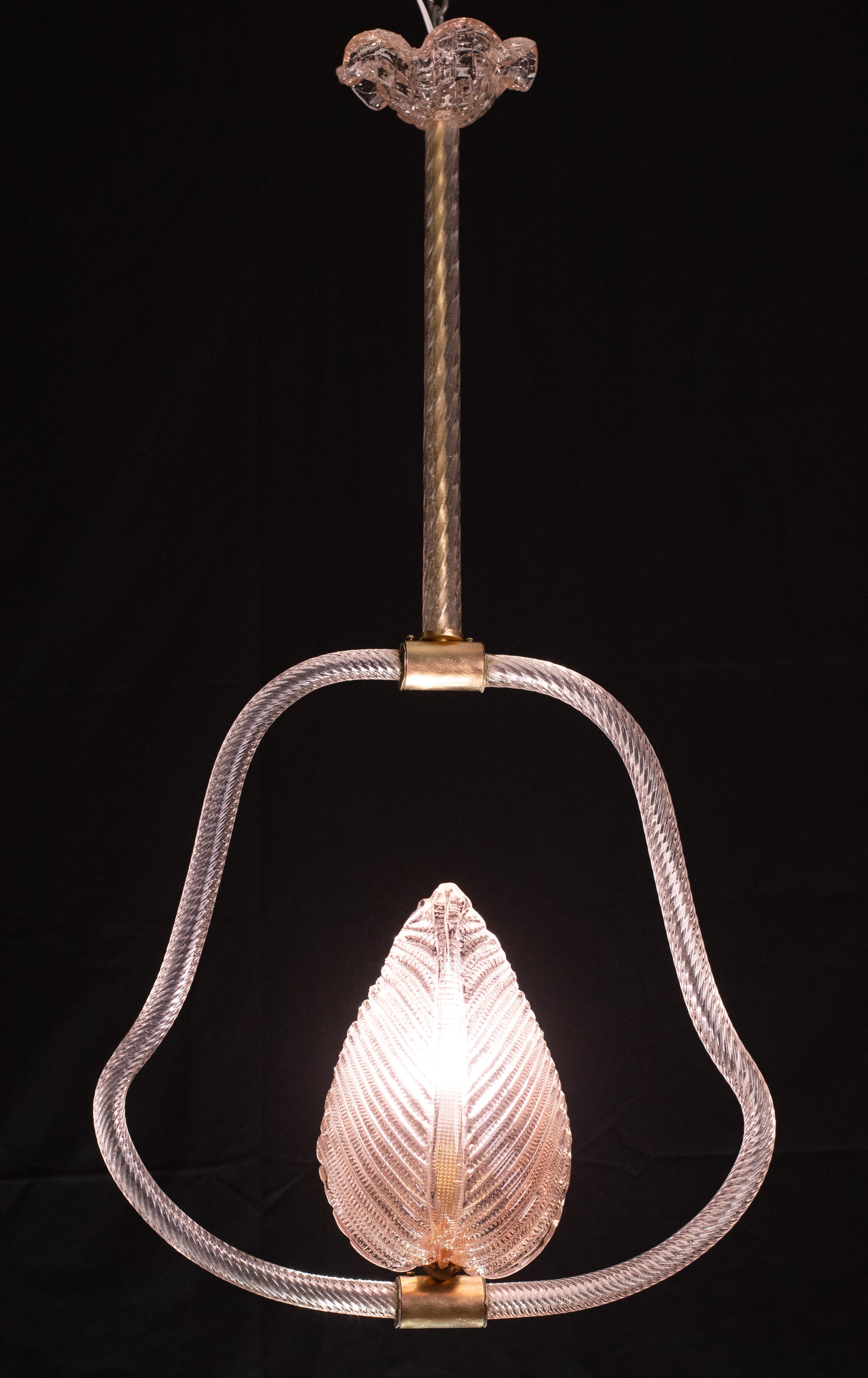 Stunning Murano chandelier by artist Ercole Barovier with rare pink glass.
The pendant consists of 6 glass elements and a brass structure.
It mounts a European standard e27 lamp.
It measures 90 centimetres in height and 47 centimetres in width,