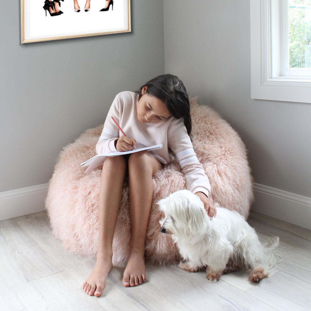 After a long day what better way for your little princess to relax in the oozing comfort in this delightful pink fur bean bag chair? 

Created by designer Australian designer, Emily Barbara and intricately handcrafted in Australia using the finest