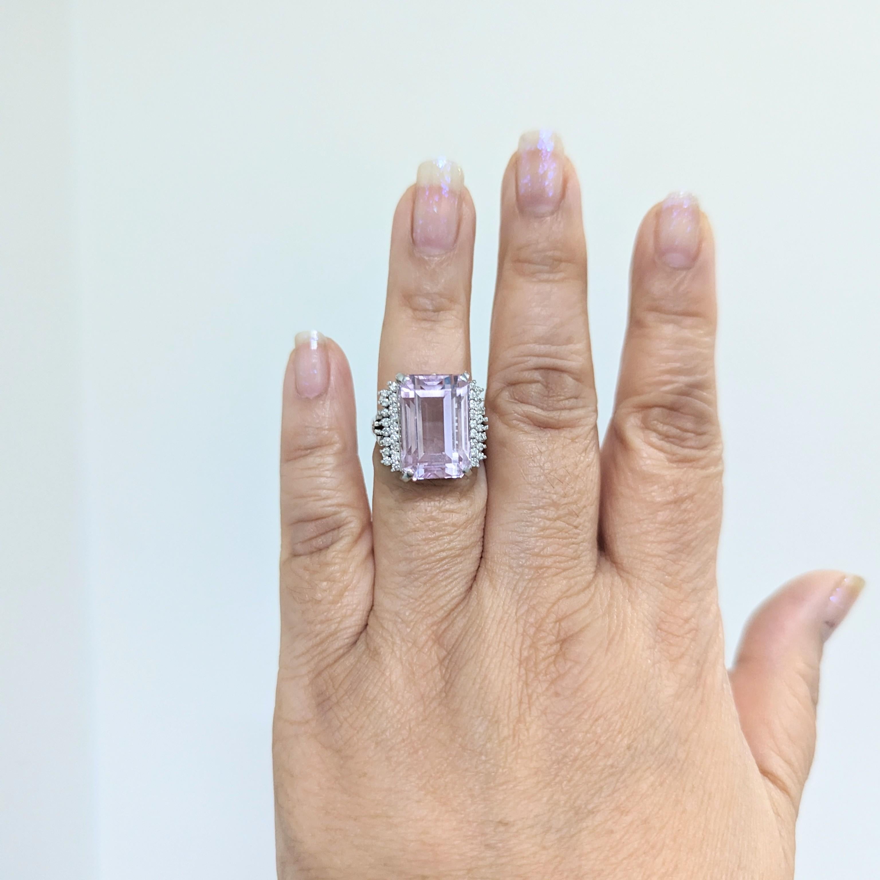 Beautiful 22.65 ct. pink kunzite emerald cut with 0.51 ct. good quality white diamond rounds.  Handmade in 18k white gold.  Ring size 7.5.
