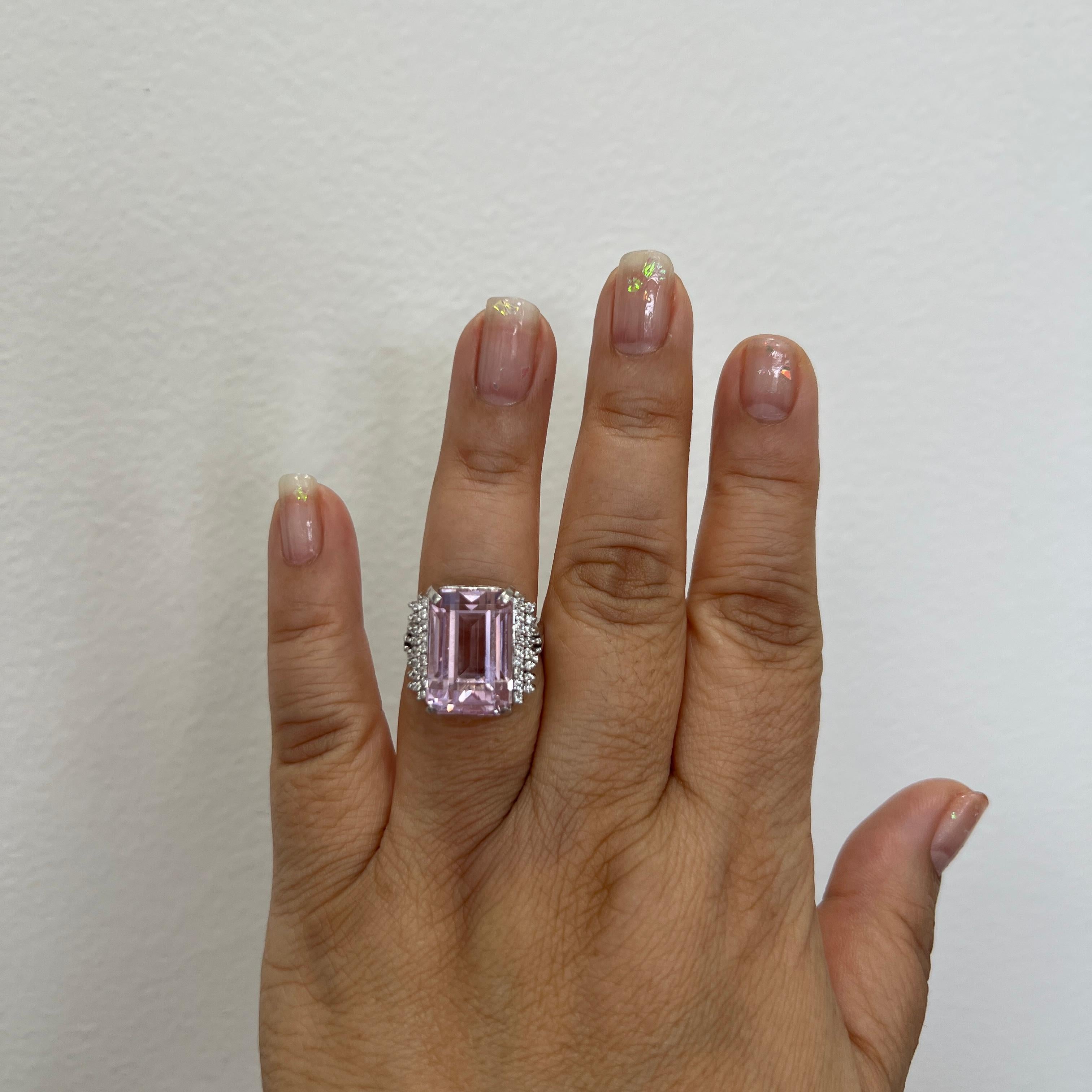 Beautiful 22.65 ct. pink kunzite emerald cut with 0.51 ct. good quality white diamond rounds.  Handmade in 18k white gold.  Ring size 7.5.