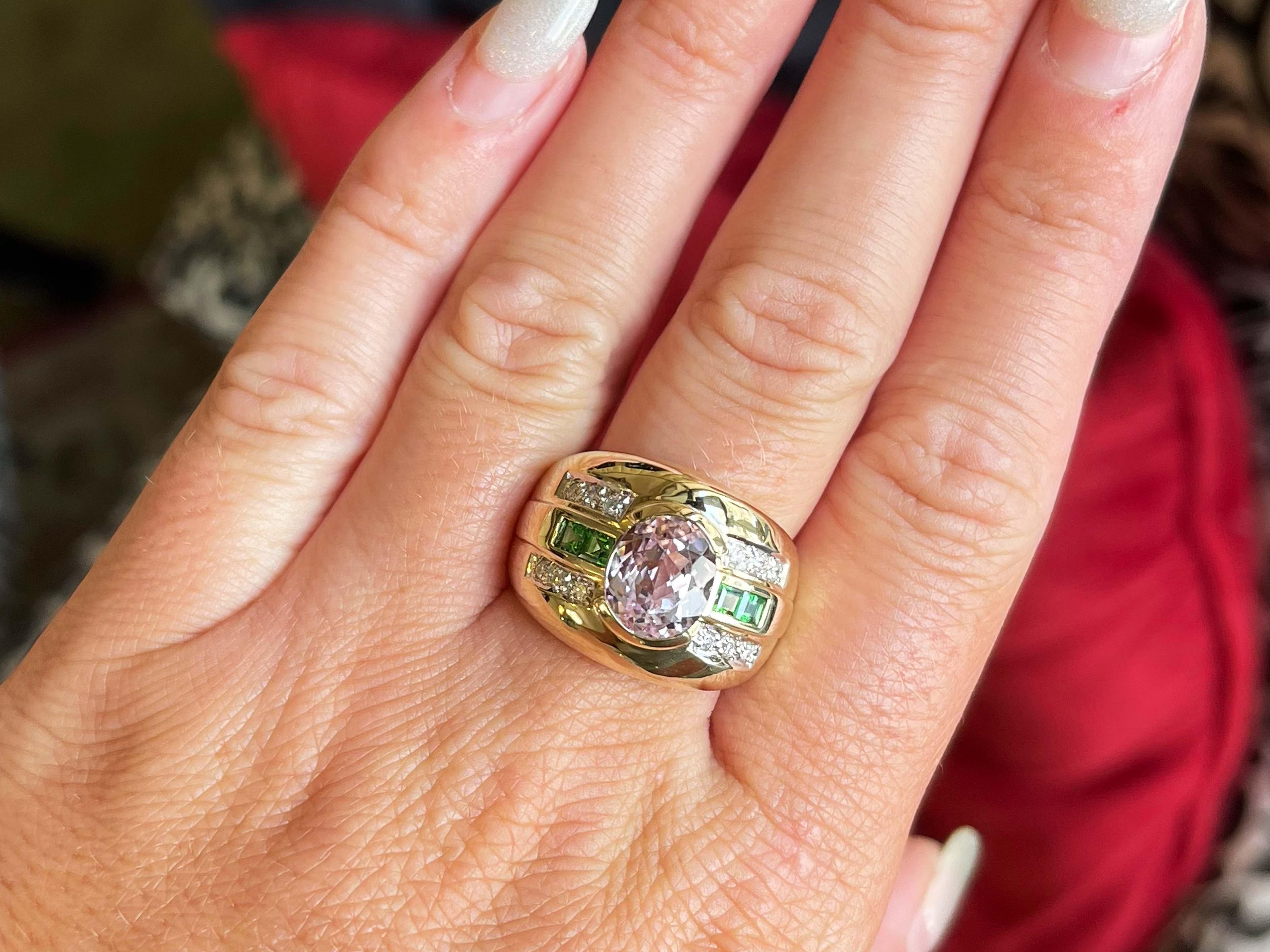 Item Specifications:

Metal: 14K Yellow Gold

Style: Statement Ring

​​Ring Size: 8.75

Total Weight: 14.5 Grams
​
​Diamond Count: 12

Diamond Color: H-I

Diamond Clarity: VS2
​
​​Green Tsavorite Garnet Count: 4

Green Tsavorite Garnet Carat Weight:
