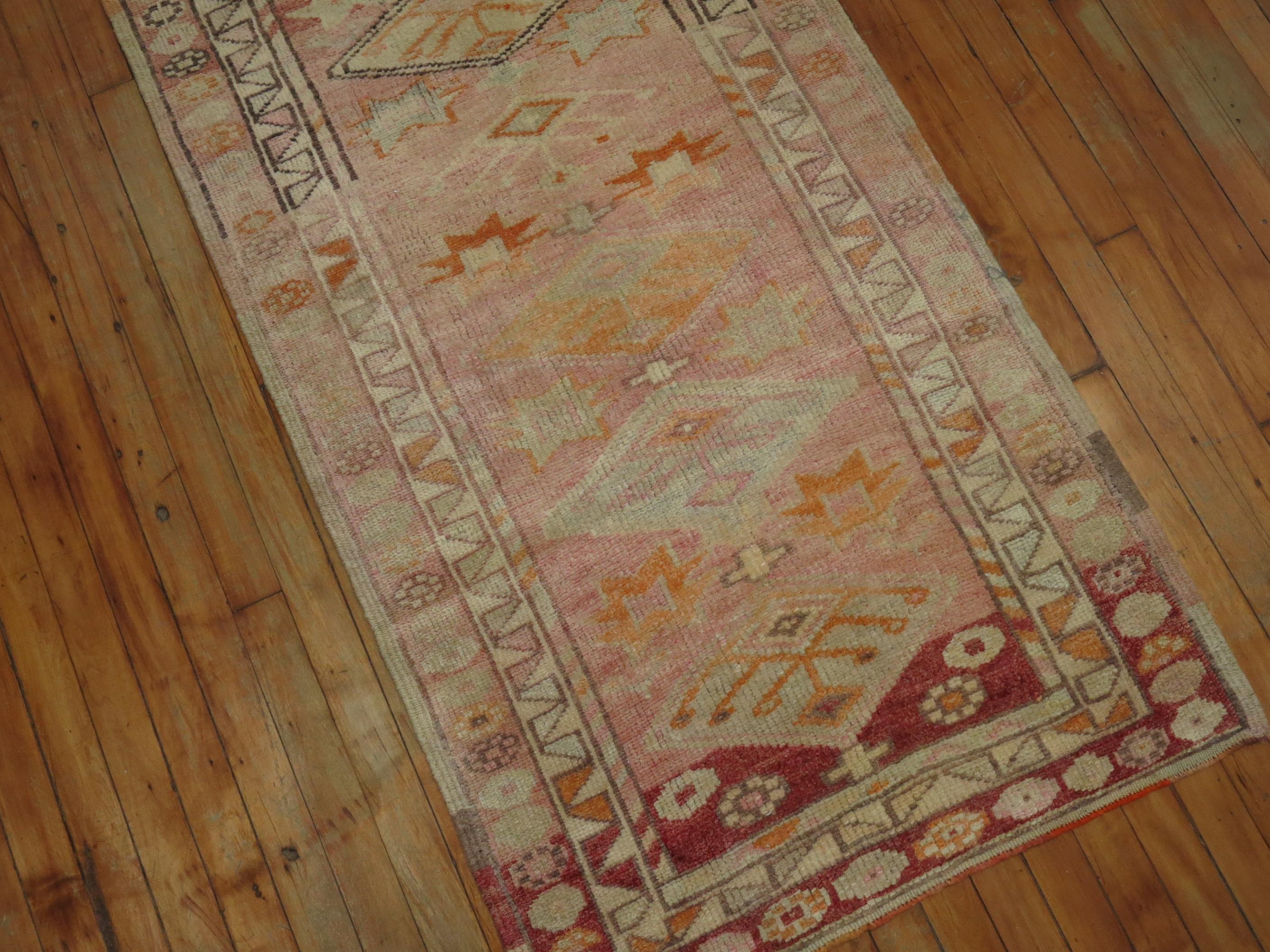 Very narrow and long Turkish Anatolian Runner, predominantly Pink. Nearly 20 feet long