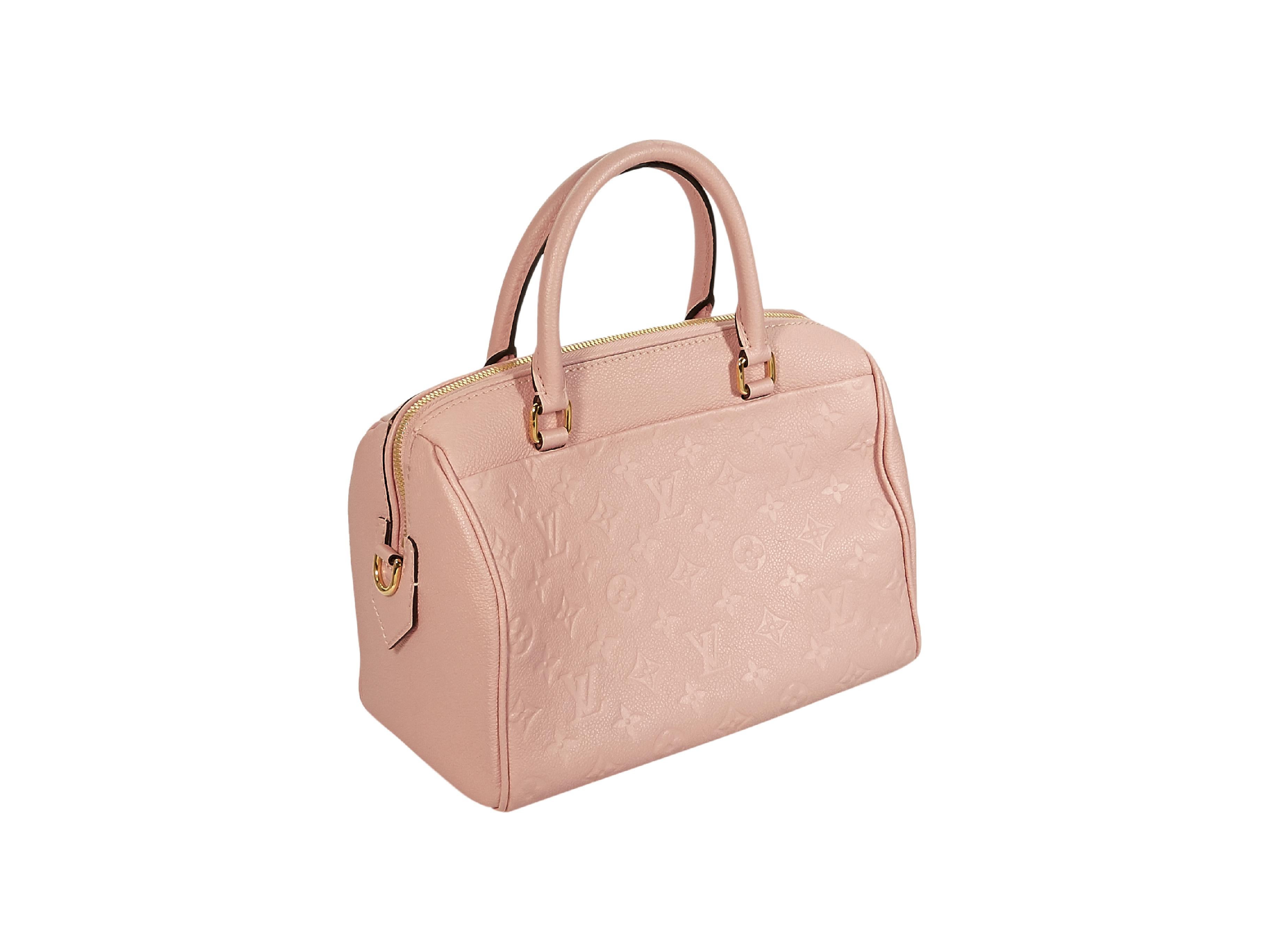 Product details:  Pink monogram leather Speedy handbag by Louis Vuitton.  Circa 2017.  Dual carry handles.  Top zip closure with lock-and-key.  Lined interior with inner slide and zip pockets.  Goldtone hardware.  10