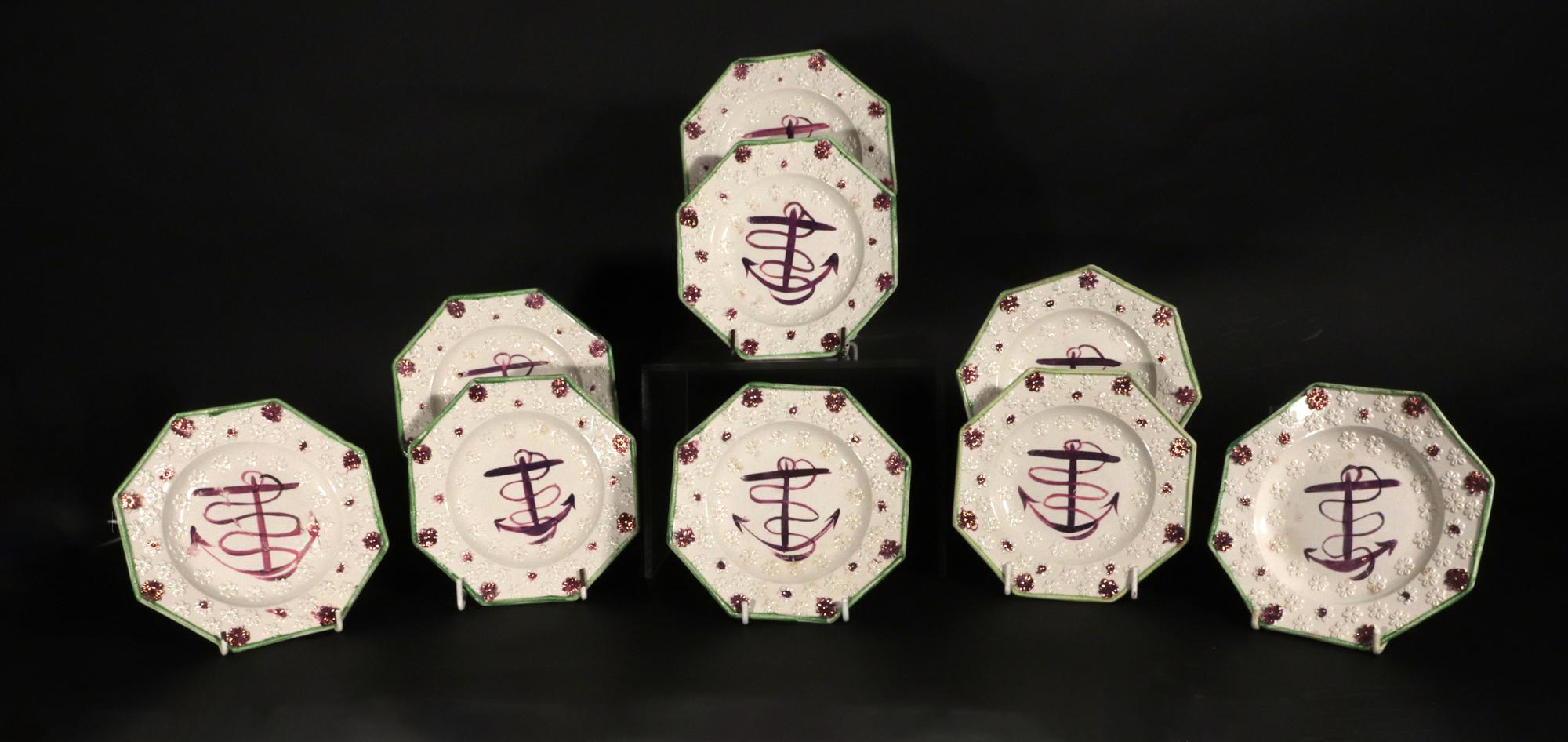 Pink Luster Fouled Anchor-decorated Octagonal Child's Side Plates,
Set of Nine,
Circa 1830-40

The set of nine octagonal children's plates are each painted in the center with a large pink luster fouled anchor.  The plates are molded with a raised