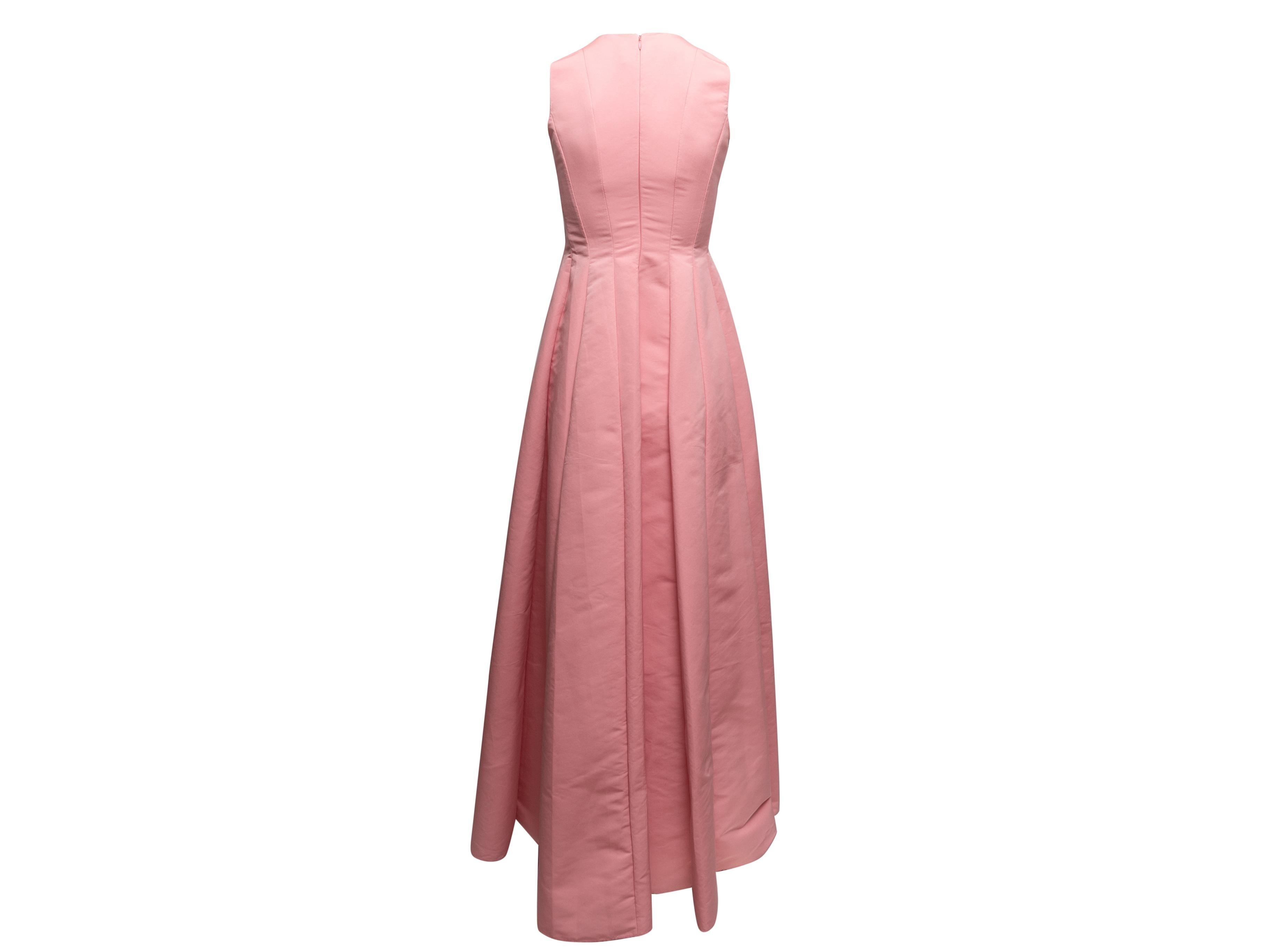 Pink sleeveless pleated satin gown by Maison Rabih Kayrouz. Crew neck. Zip closure at back. 28