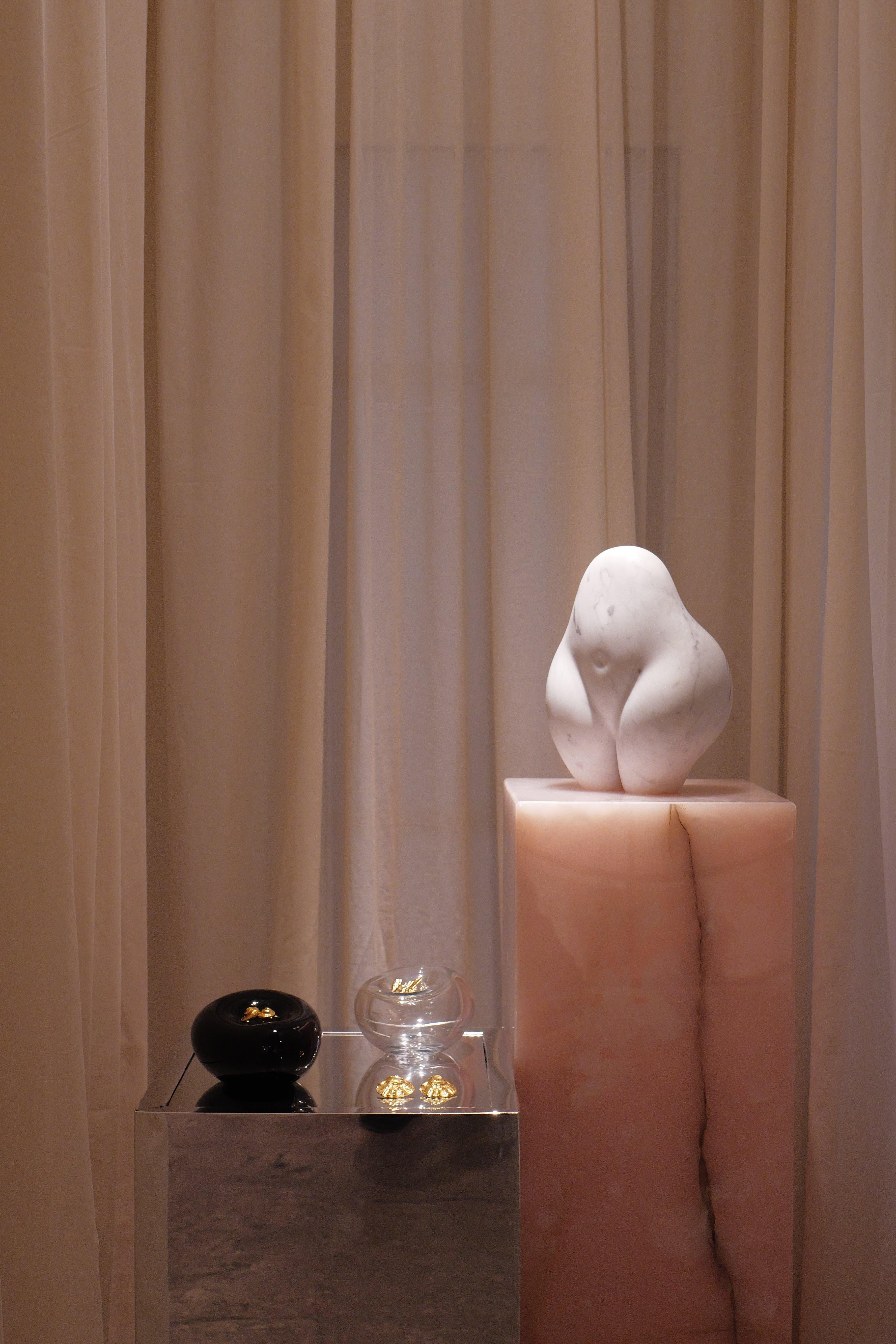 Pink Onyx Base — Perfect for elegantly displaying a sculpture or vase.

**Maintenance:** Your piece is unique and designed to last a lifetime. While all our marbles are treated, a bit of care will ensure the longevity of your marble item. We