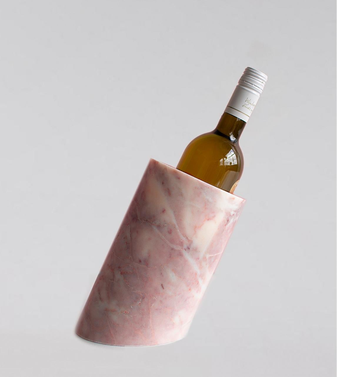 Our wine cooler is designed by us and hand crafted by the artisans within the fair-trade principles.

The natural properties of the marble will keep your wine chilled with no need for ice - you can also place this marble cooler in the fridge for