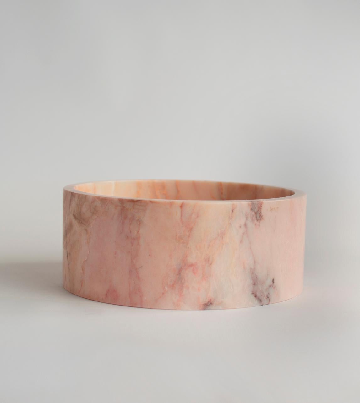This substantial pink marble bowl is beautifully handcrafted from a single piece of genuine Turkish Black Marble and honed for a silky mat finish. 

There may be natural variations that are not product flaws, they make your design truly