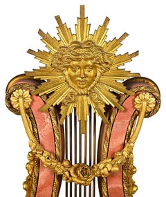 Pink marble Lyre shape mantle clock, 19th Century.