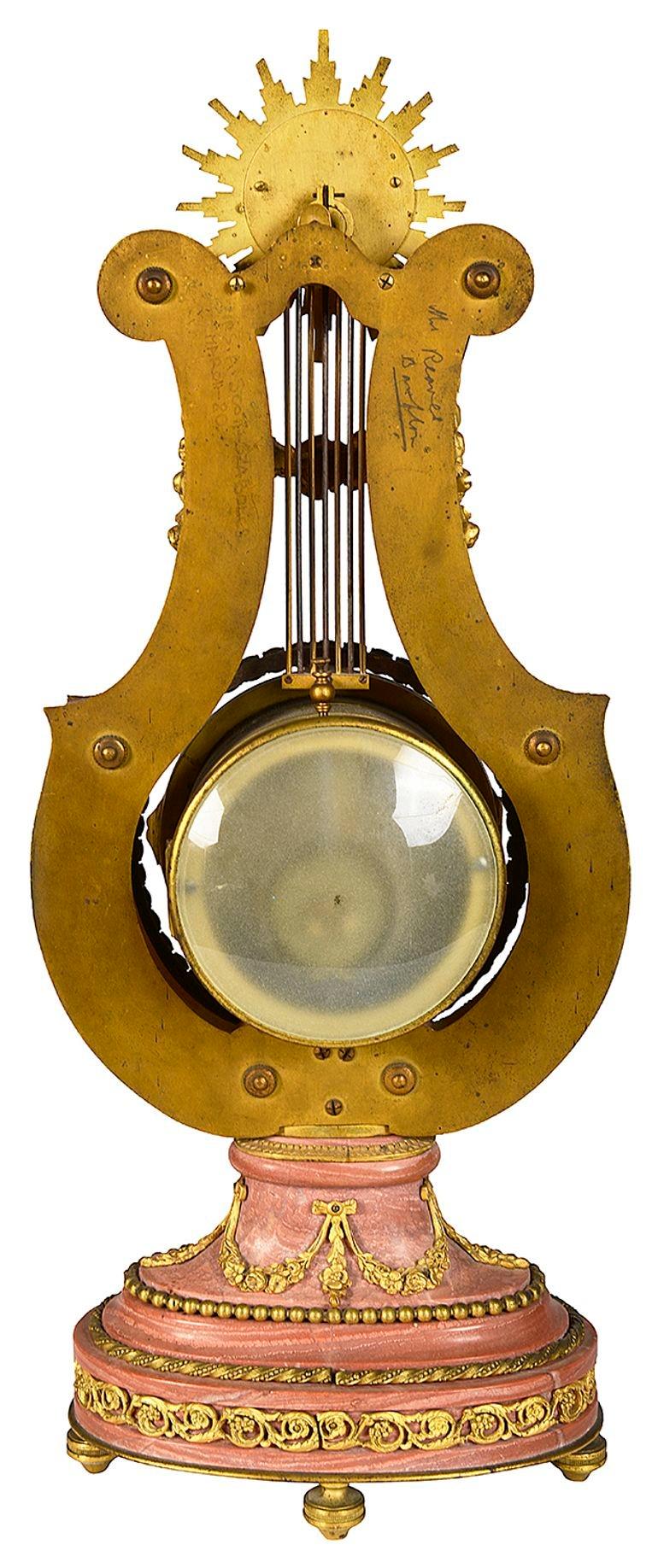 Ormolu Pink marble Lyre shape mantle clock, 19th Century. For Sale