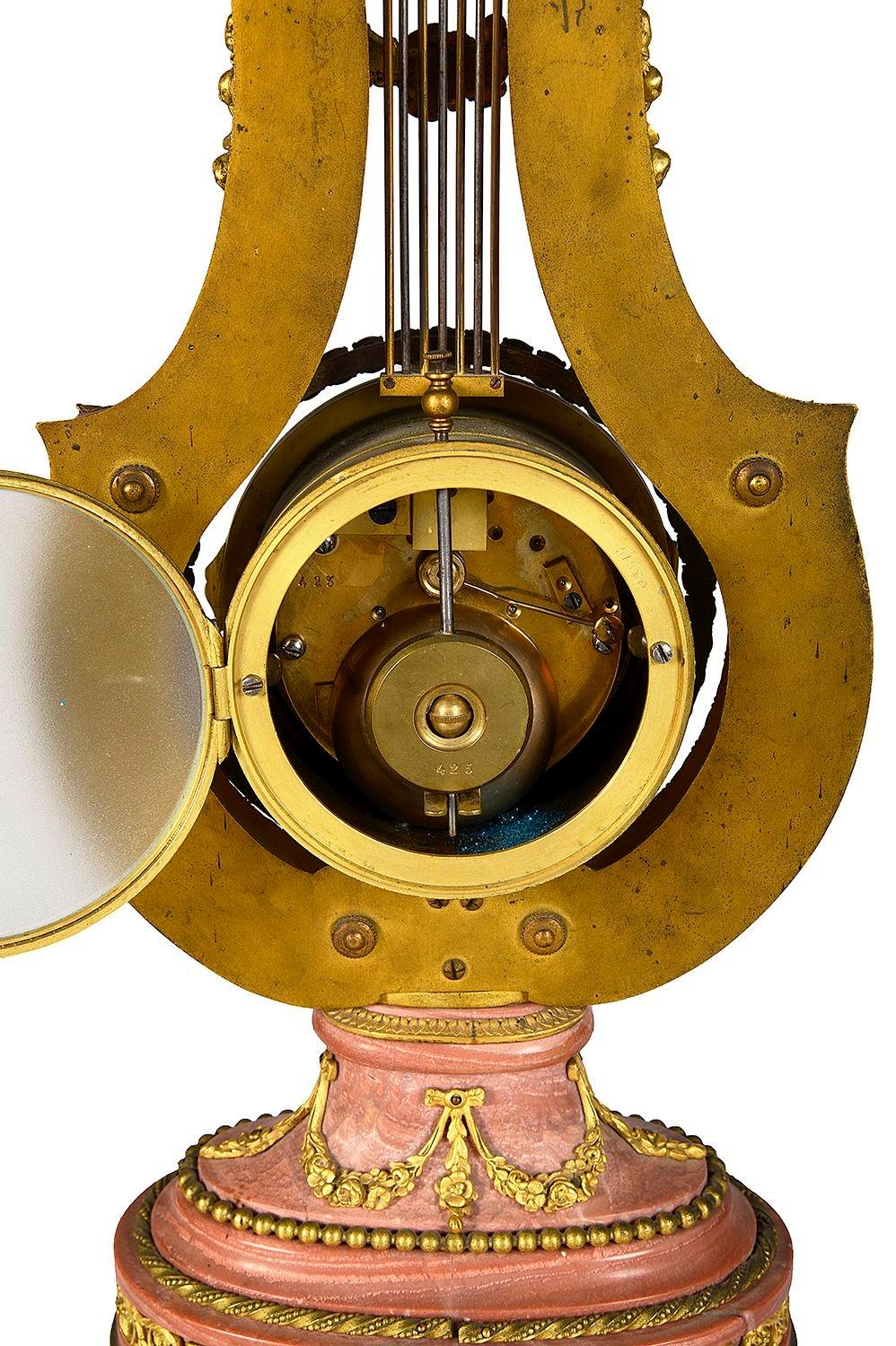 Ormolu Pink marble Lyre shape mantle clock, 19th Century. For Sale