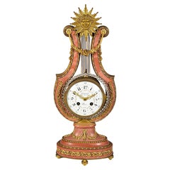 Pink marble Lyre shape mantle clock, 19th Century.