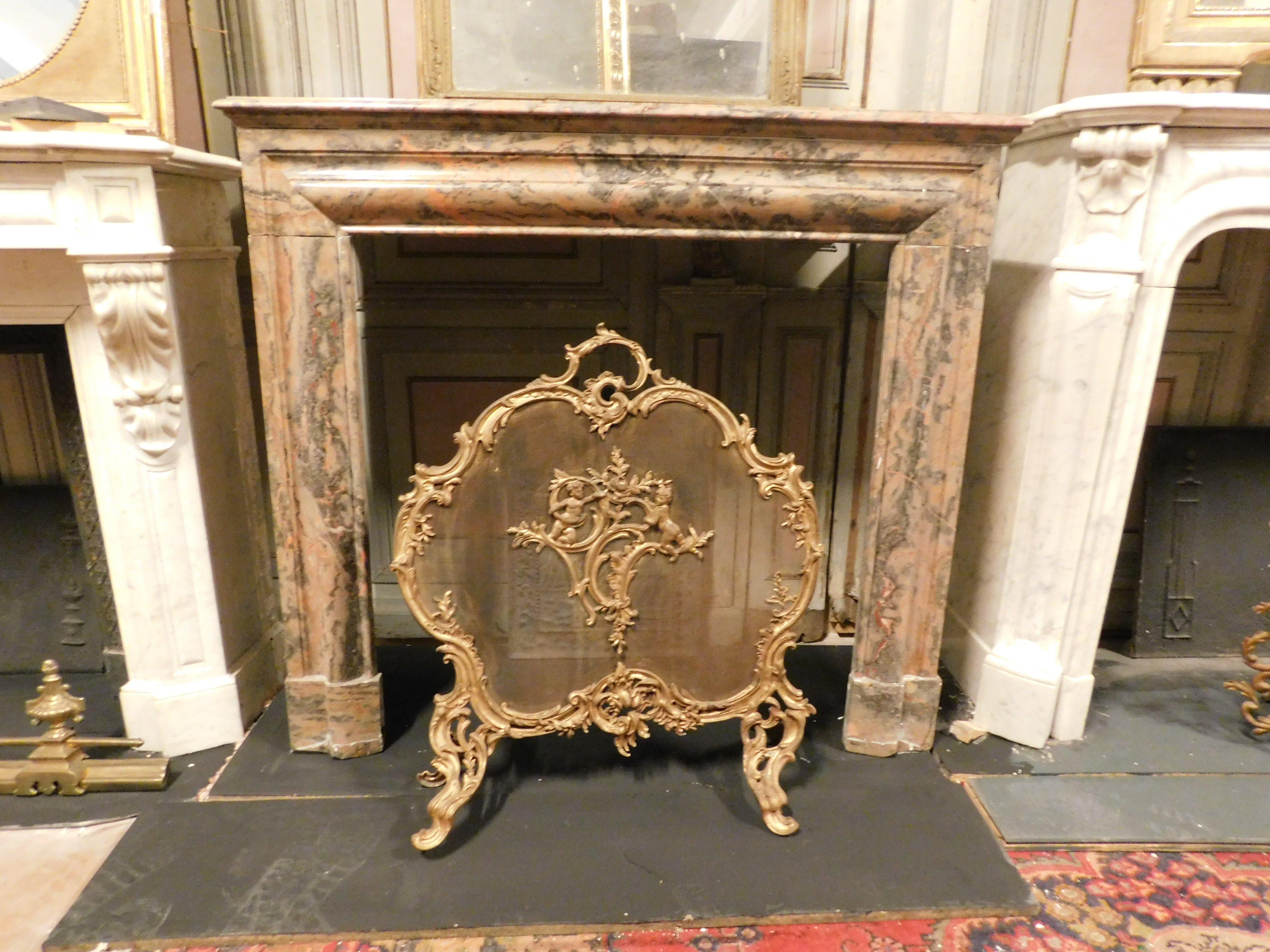 Antique Mantle Fireplace, carved in pink marble with precious black or pink orange veins, simple geometric shape, salvator rosa type, original from the late 19th century, originating in Italy.
Maximum measurements cm w114 x H 105 x D 35, the