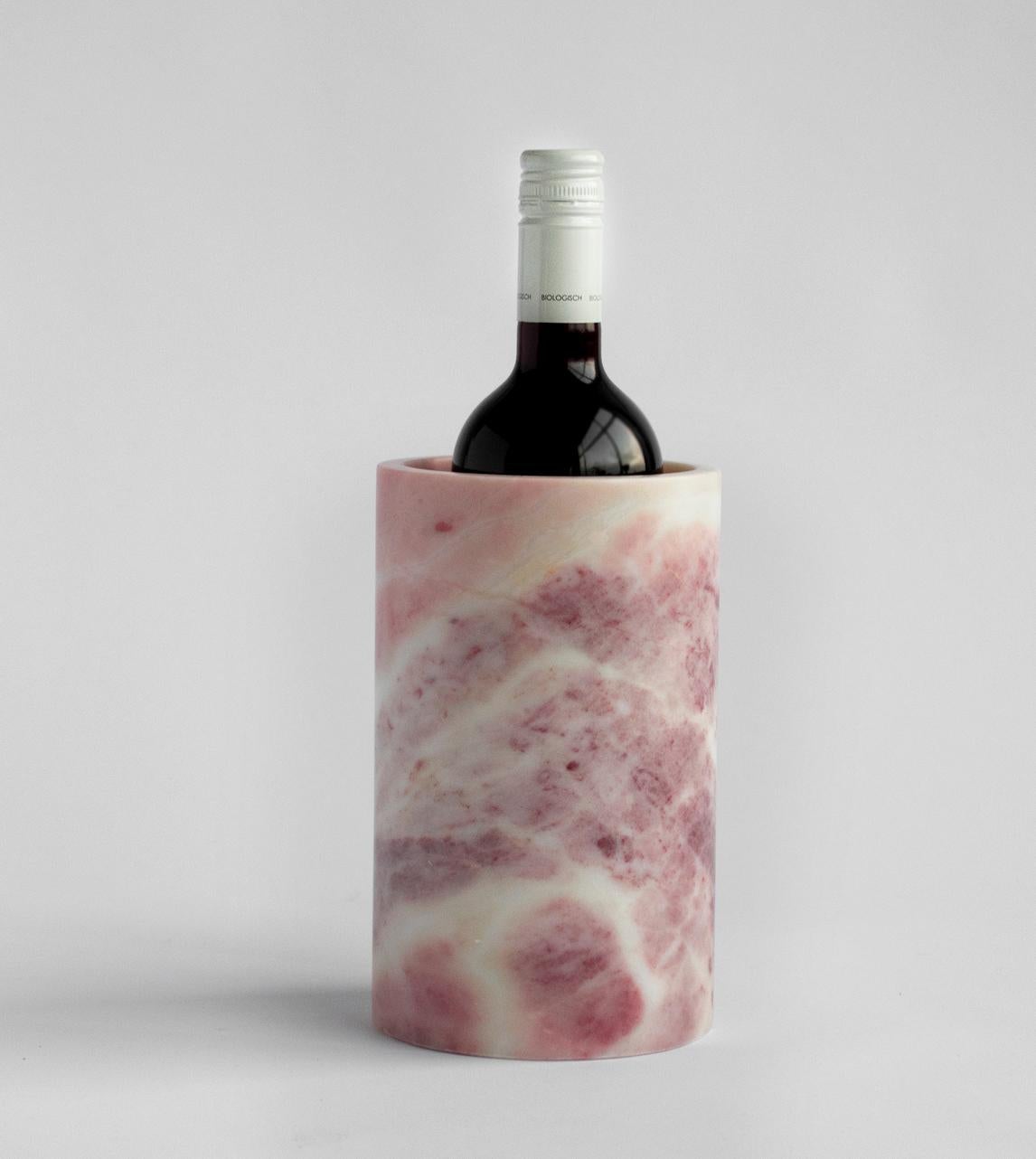 Our wine cooler is designed by us and hand crafted by the artisans within the fair-trade principles.

The natural properties of the marble will keep your wine chilled with no need for ice - you can also place this marble cooler in the fridge for