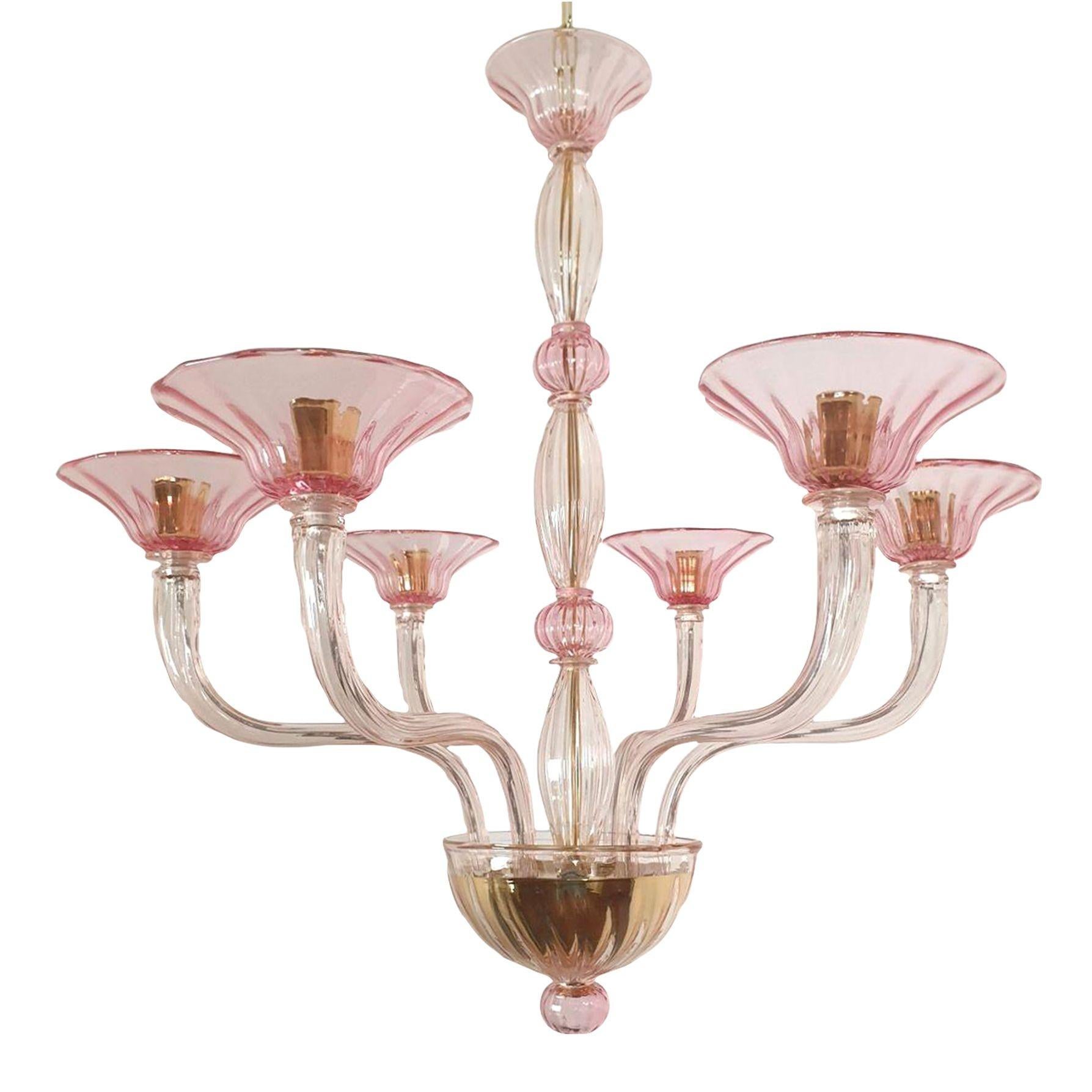 Mid century modern pink Murano glass chandelier, Venini style, Italy late 1970s.
The Italian chandelier is made of handmade Murano glass, in two pink colors.
It has 6 lights and arms and is professionally rewired for the US. (complimentary European
