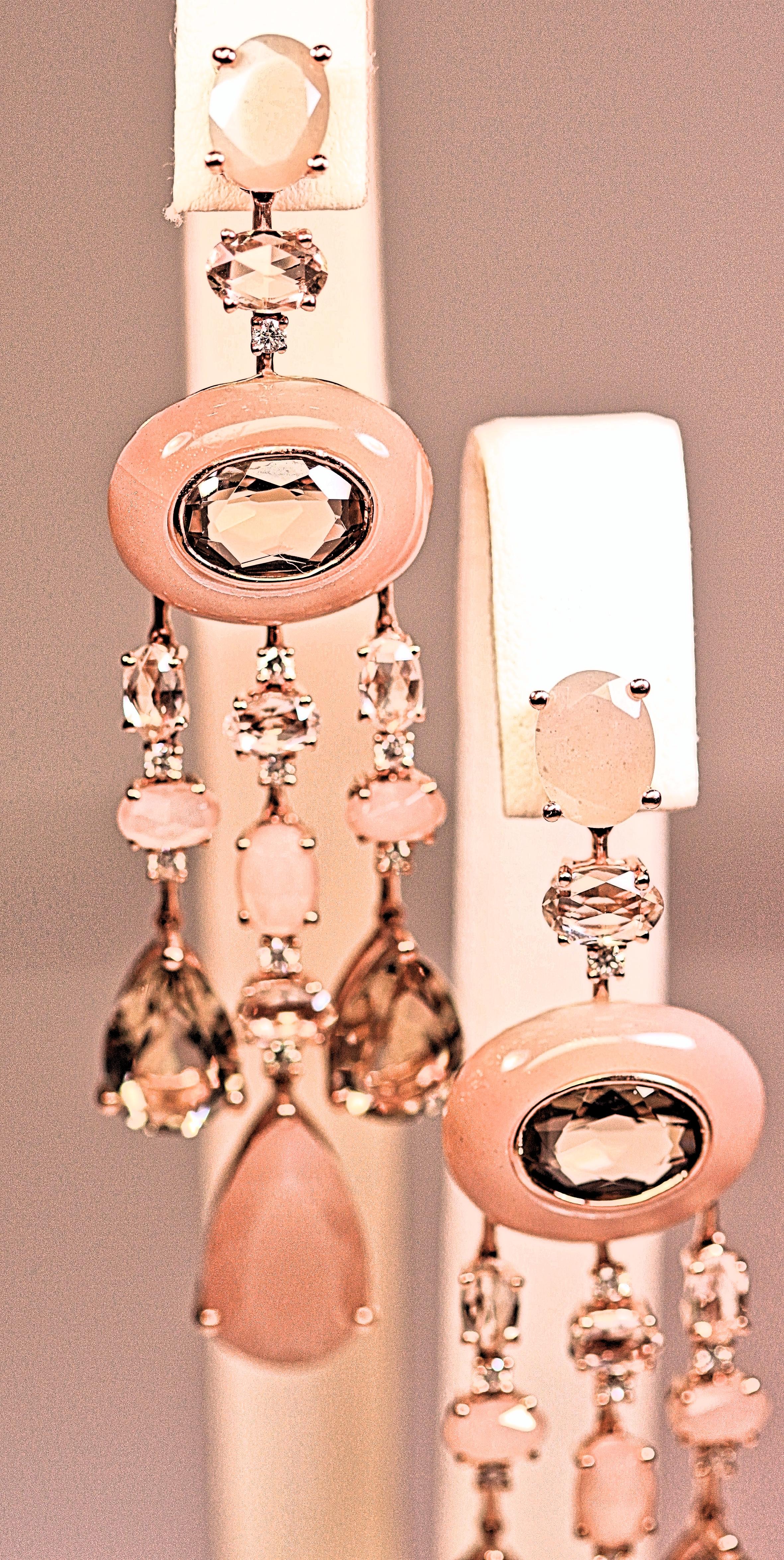These beautiful and sexy earrings are made from pink moonstone, smokey quartz and diamonds.  Stunning pink and brown dangle earrings, that measure almost 3 inches long. The earrings are 18 karat rose gold. The moonstones weigh 19.77 carats total,