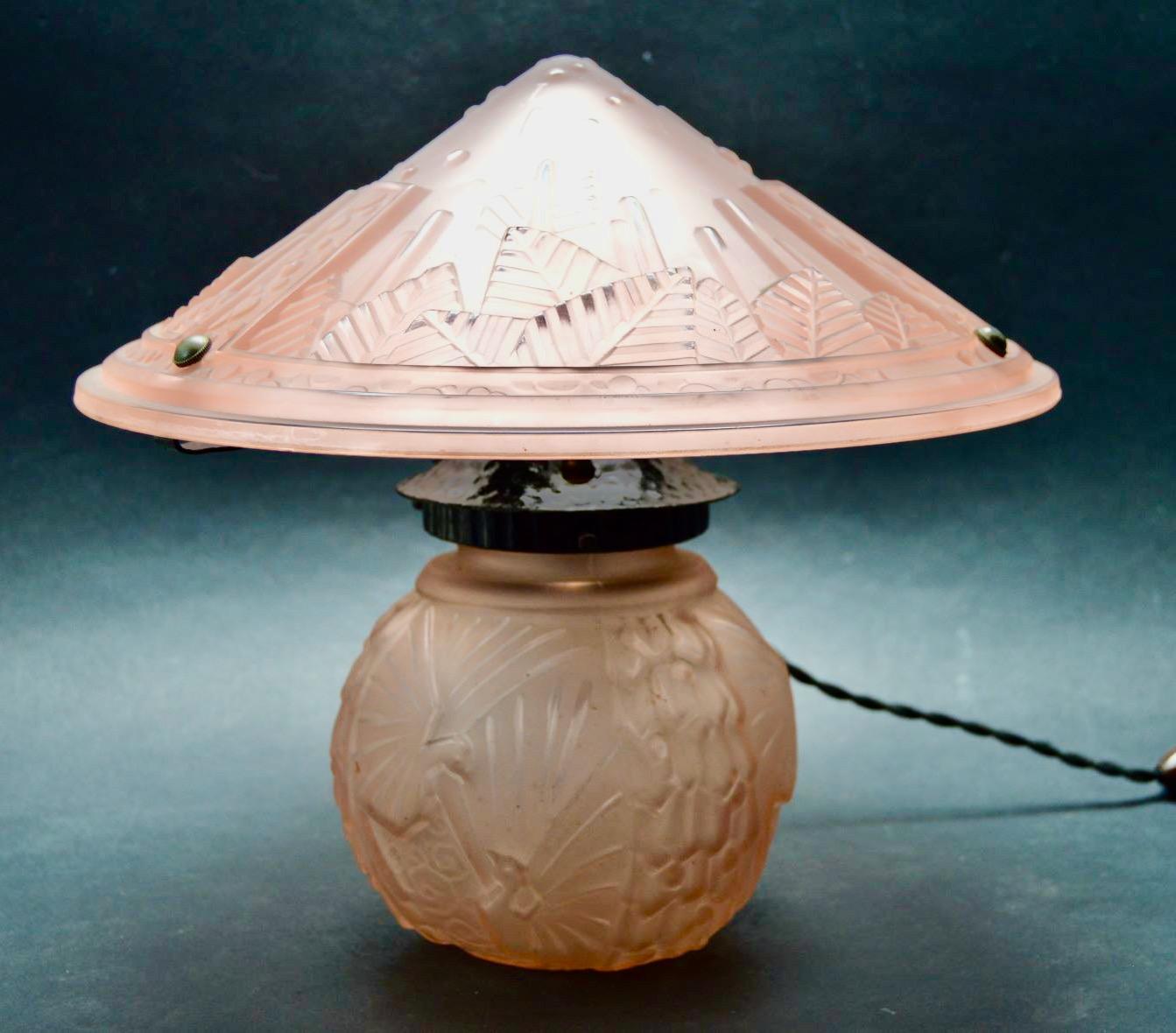 Pink Muller Freres Luneville 2 piece mushroom salmon color glass lamp. Pressed glass representing the classic Muller Freres light designs. This particular rare lamp is in excellent condition representing the state of this art form from the 1930s. We